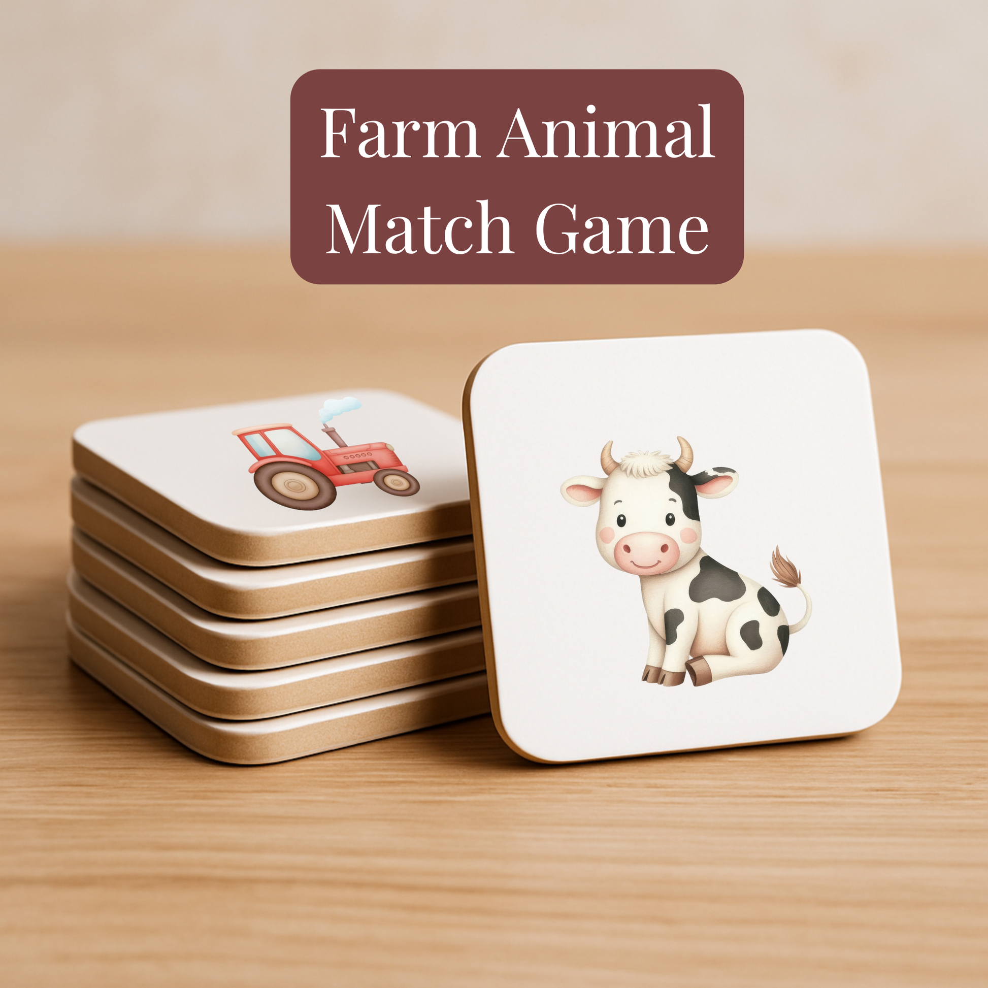 A stack of square cards from Mirabilia Boutique’s Farm Animal Match Game | Kids Memory Game | 15 Pairs rests on wood—top cards show a cartoon cow and red tractor, ideal for preschool memory activities.