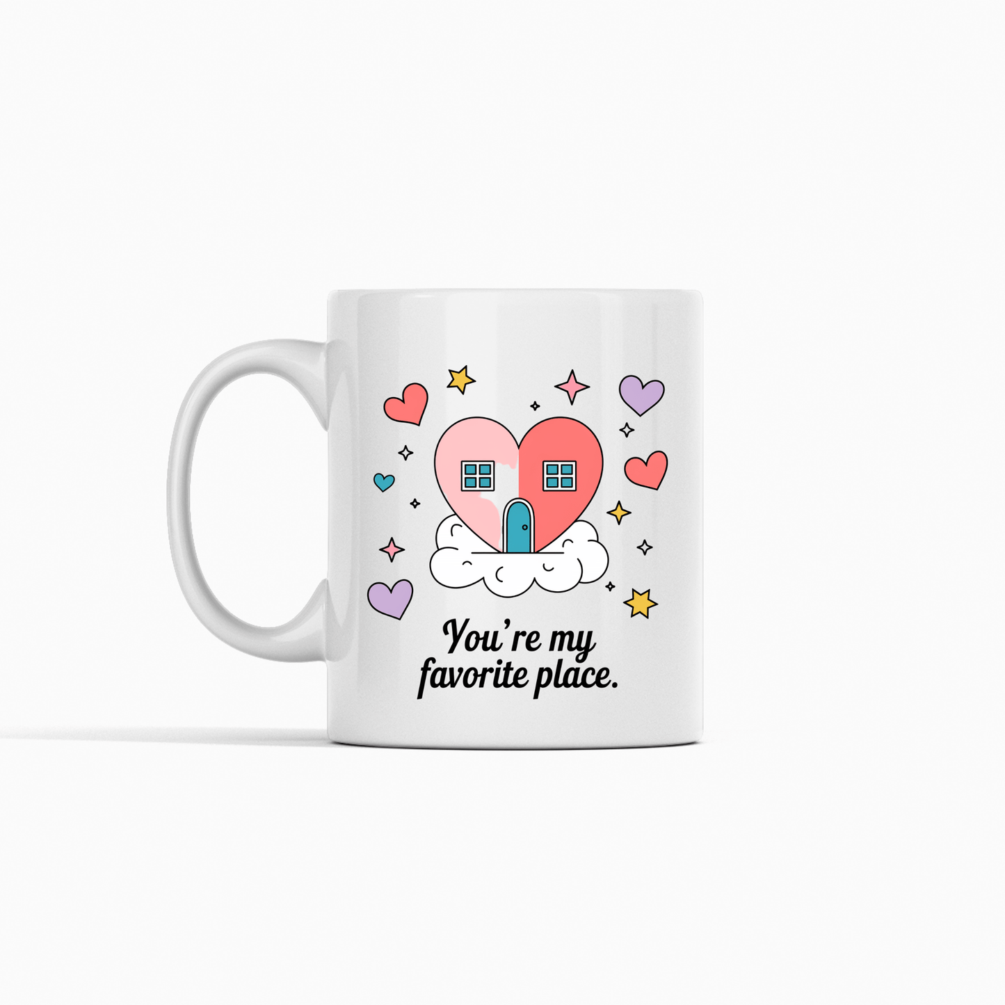 The Heart House Mug by Mirabilia Boutique features a charming house in a pink heart on a cloud, with stars and hearts. Below, it reads, "You're my favorite place." A perfect gift for someone special.