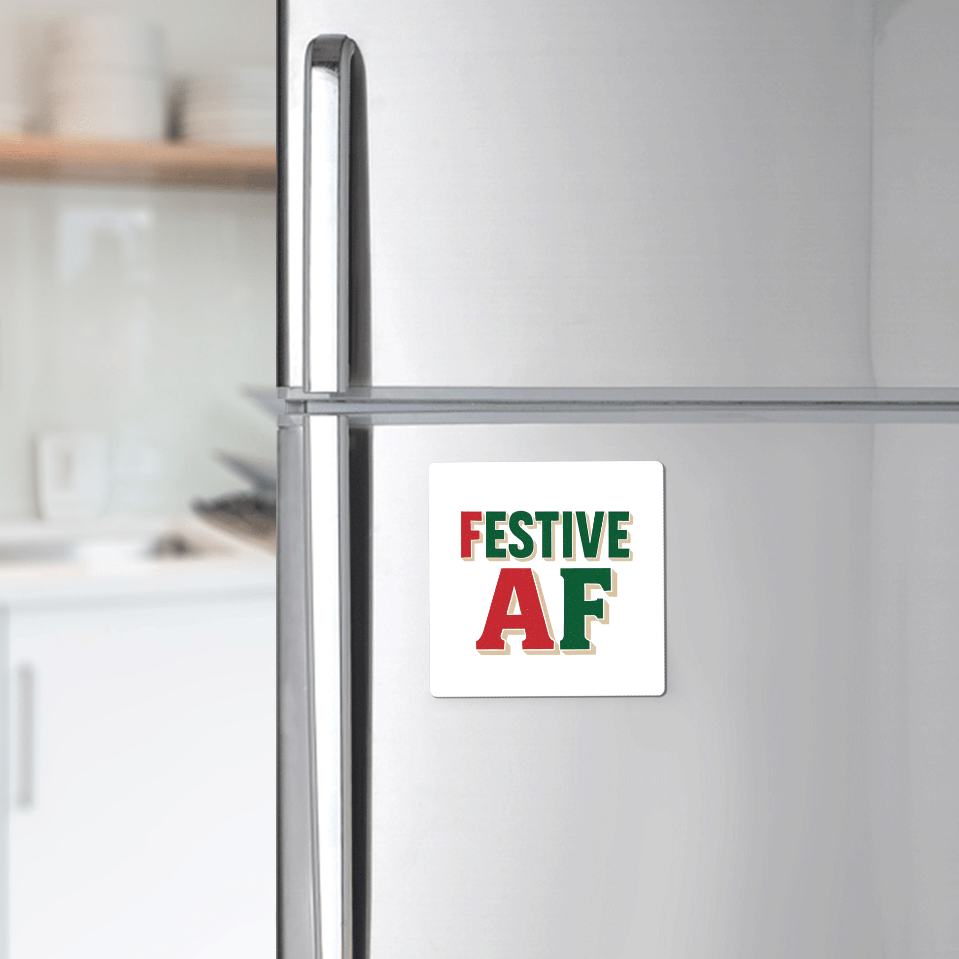 The Festive AF Magnet by Mirabilia Boutique features bold red and green text—perfect as a funny holiday decor gift or stocking stuffer to add cheer to any modern kitchen.