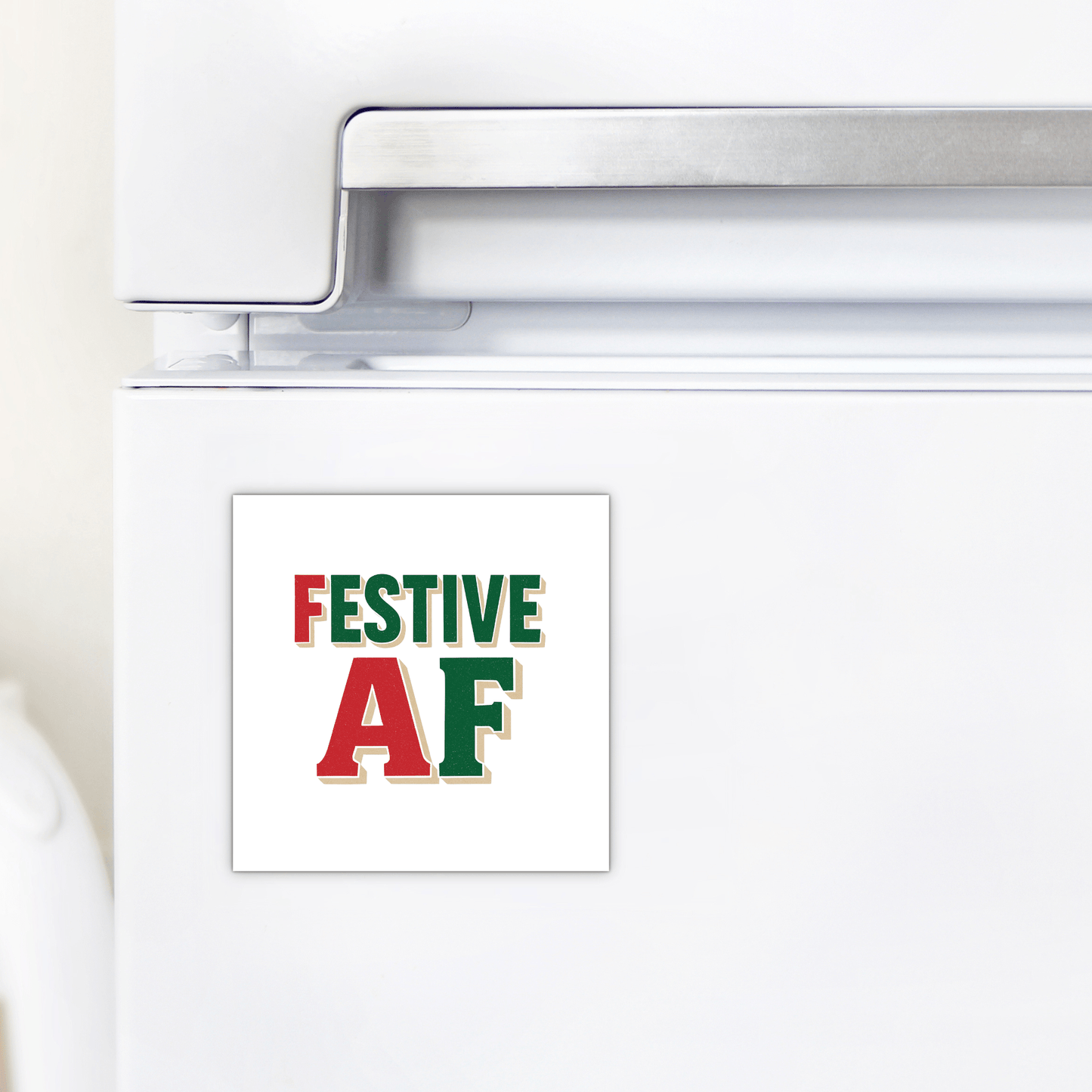 A white refrigerator sports the Mirabilia Boutique Festive AF Magnet—bold red and green text makes this funny holiday decor gift a perfect quirky stocking stuffer or Christmas decoration.