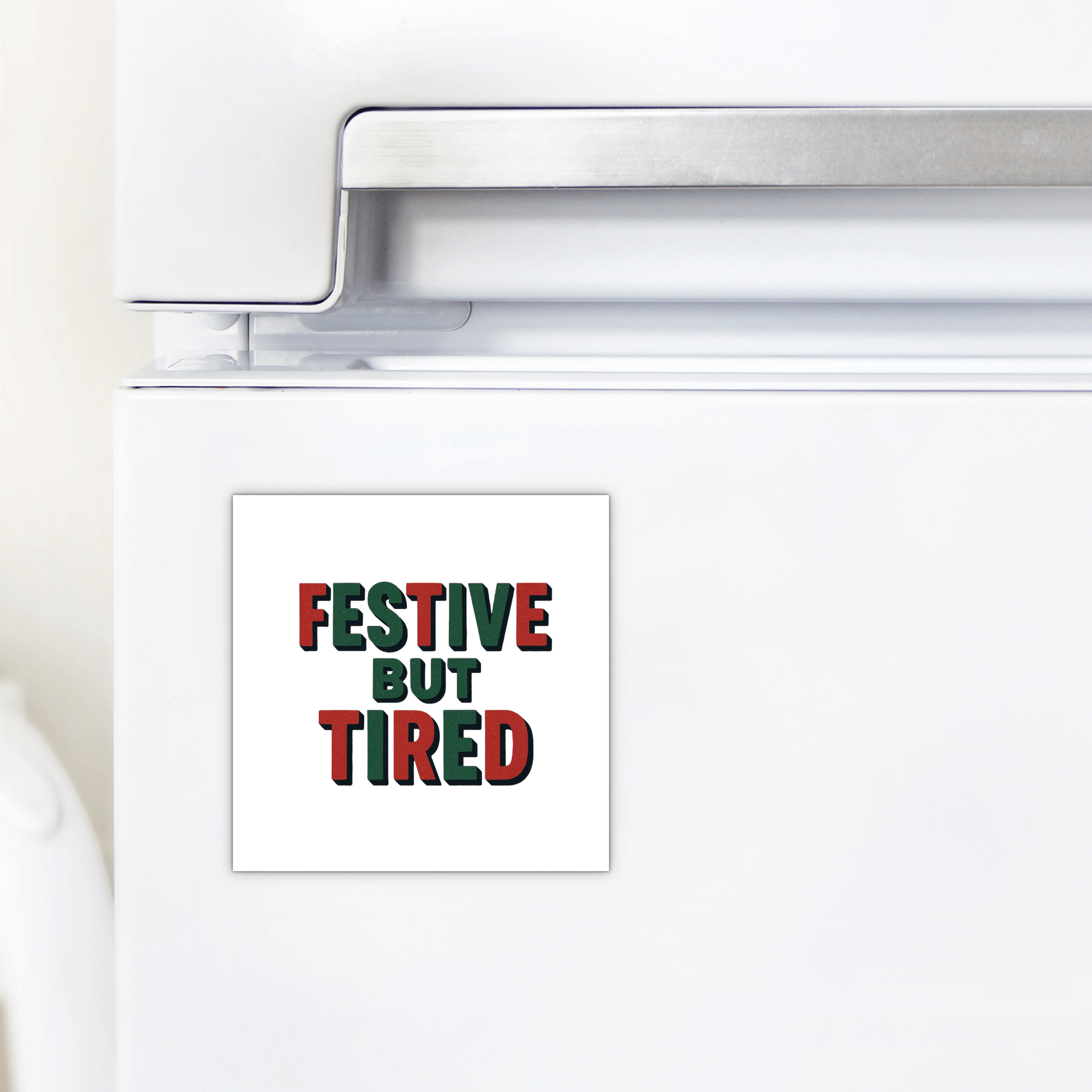 The Festive But Tired Magnet by Mirabilia Boutique features bold green and red text on white—a funny holiday mood gift or stocking stuffer for your fridge this season.