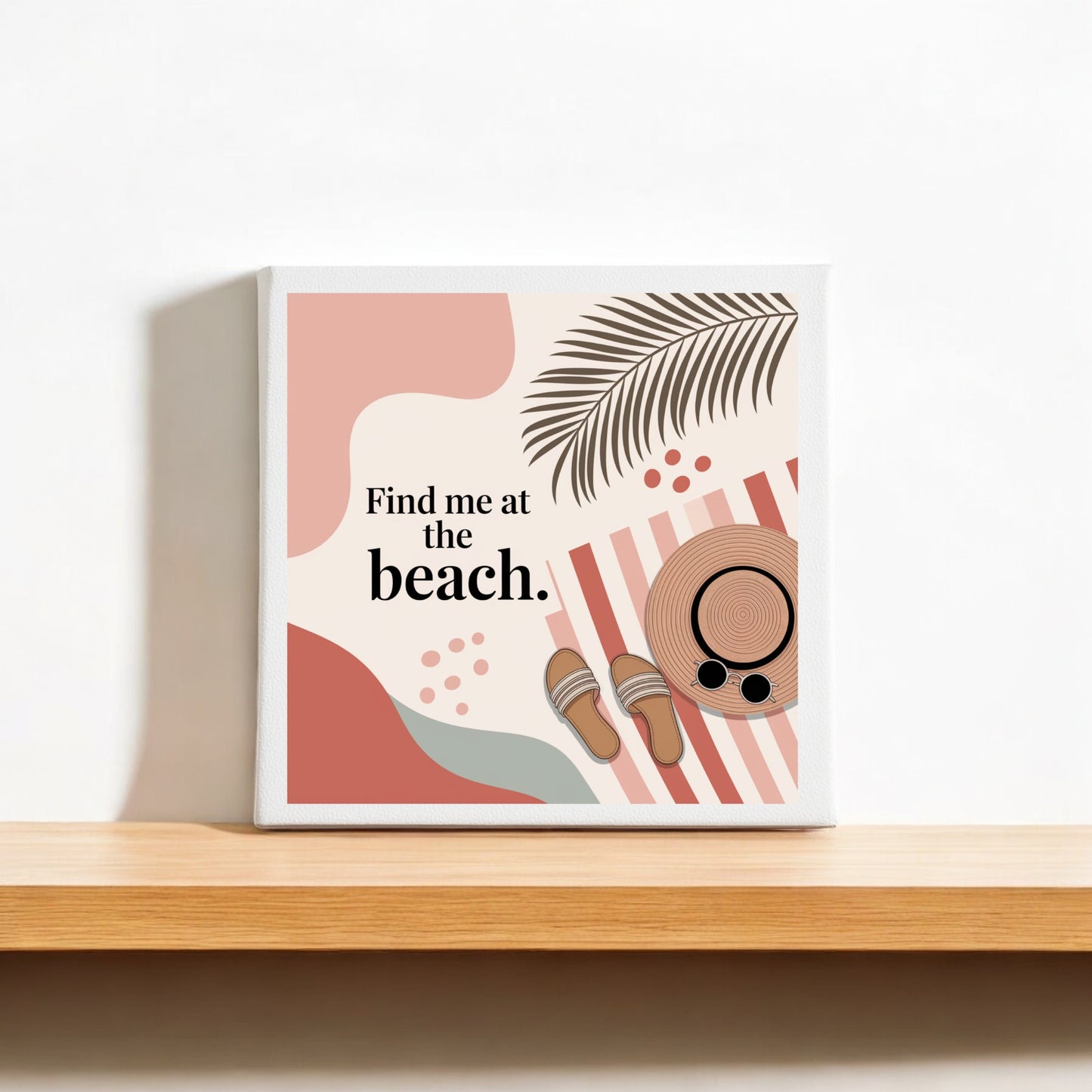 The Find Me at the Beach Canvas – Coastal Summer Vibes by Mirabilia Boutique features abstract shapes, a palm leaf, sandals, sunglasses, and a sun hat with bold text—perfect coastal home decor or summer wall art.