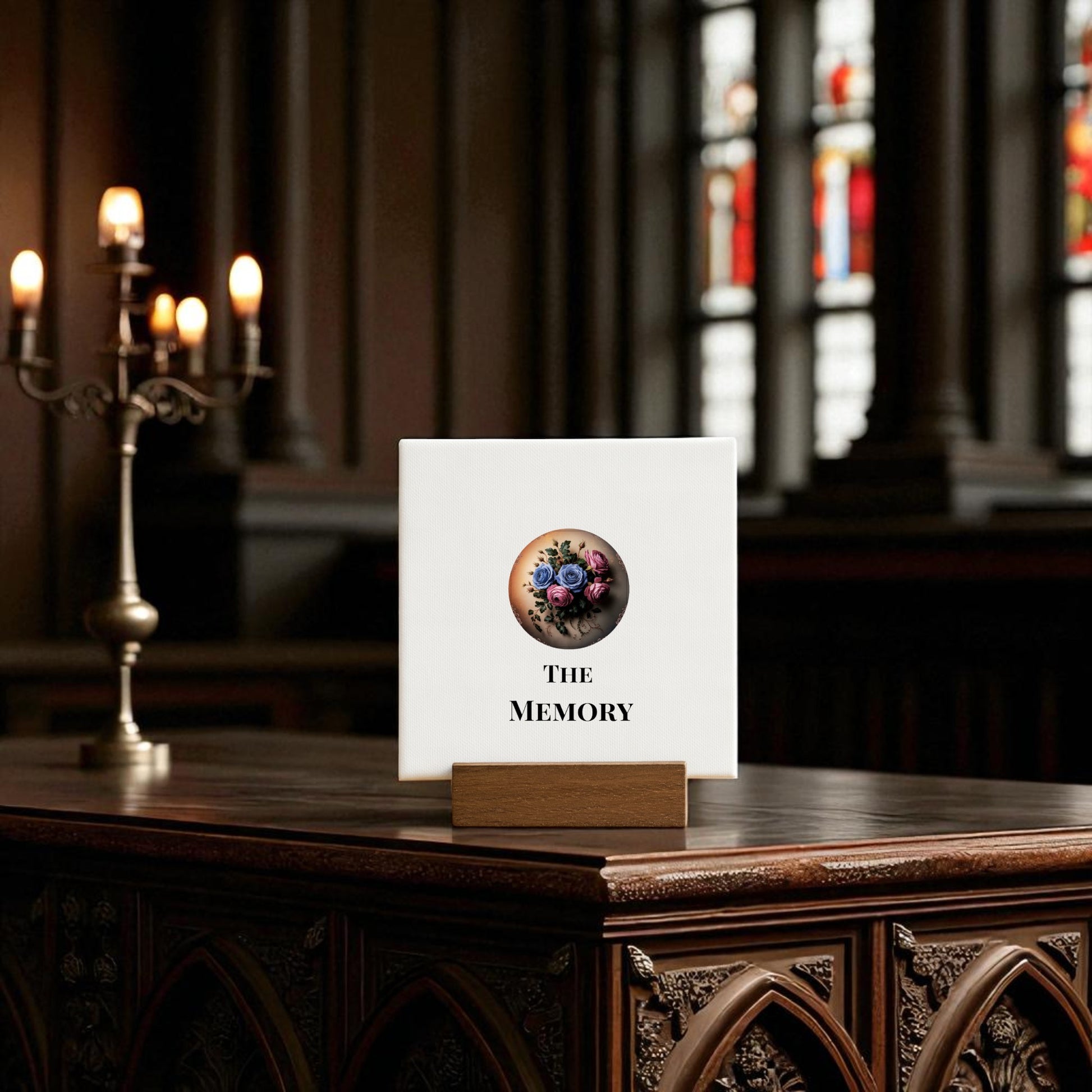 A mini gothic sign from Mirabilia Boutique, "The Memory" by Dead Regency Floral, sits on a wooden holder—an ideal gothic decor piece or remembrance gift for moody rooms with ornate tables and stained glass.