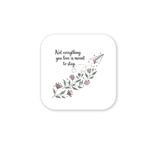 The Grief Quote Magnet by Mirabilia Boutique features floral art, a paper airplane, and the text "Not everything you love is meant to stay," making it a thoughtful sympathy gift with pink flowers and green leaves on white.