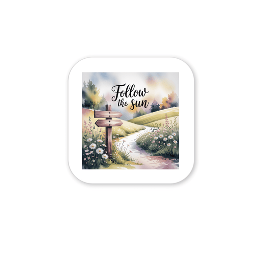 The "Follow the Sun Magnet" by Mirabilia Boutique features a scenic path through grassy hills and wildflowers with a wooden signpost and elegant script—an inspiring nature quote for your fridge or locker.