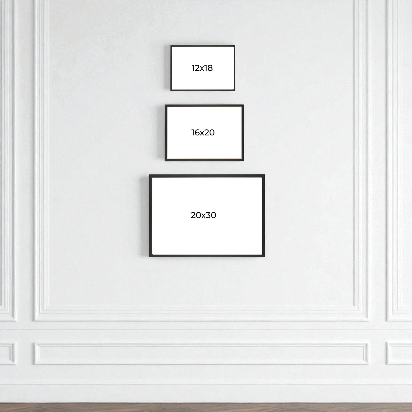Three black-framed rectangular frames (12x18, 16x20, 20x30) from Mirabilia Boutique display "Moonlit Tufas at Mono Lake" by Rachna Jain, hung vertically on a white wall with molding for striking landscape decor.