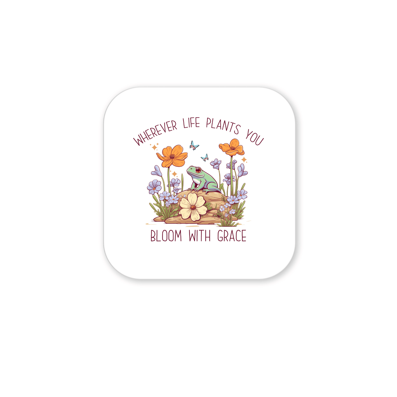 The Frog Magnet by Mirabilia Boutique features a cute frog on a rock with vibrant flowers and butterflies, plus the message: "Wherever life plants you, bloom with grace." Ideal as inspirational decor or a thoughtful gift.