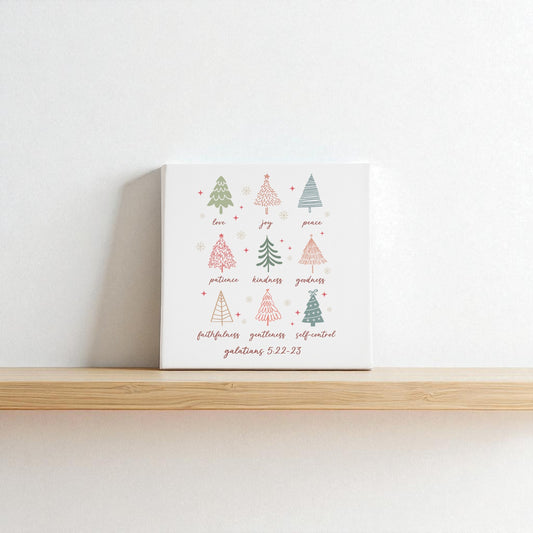 The "Fruits of the Spirit" canvas by Mirabilia Boutique features hand-drawn Christmas trees, words like "love," "joy," and Galatians 5:22—making it a perfect Christian Christmas gift and meaningful holiday decor.