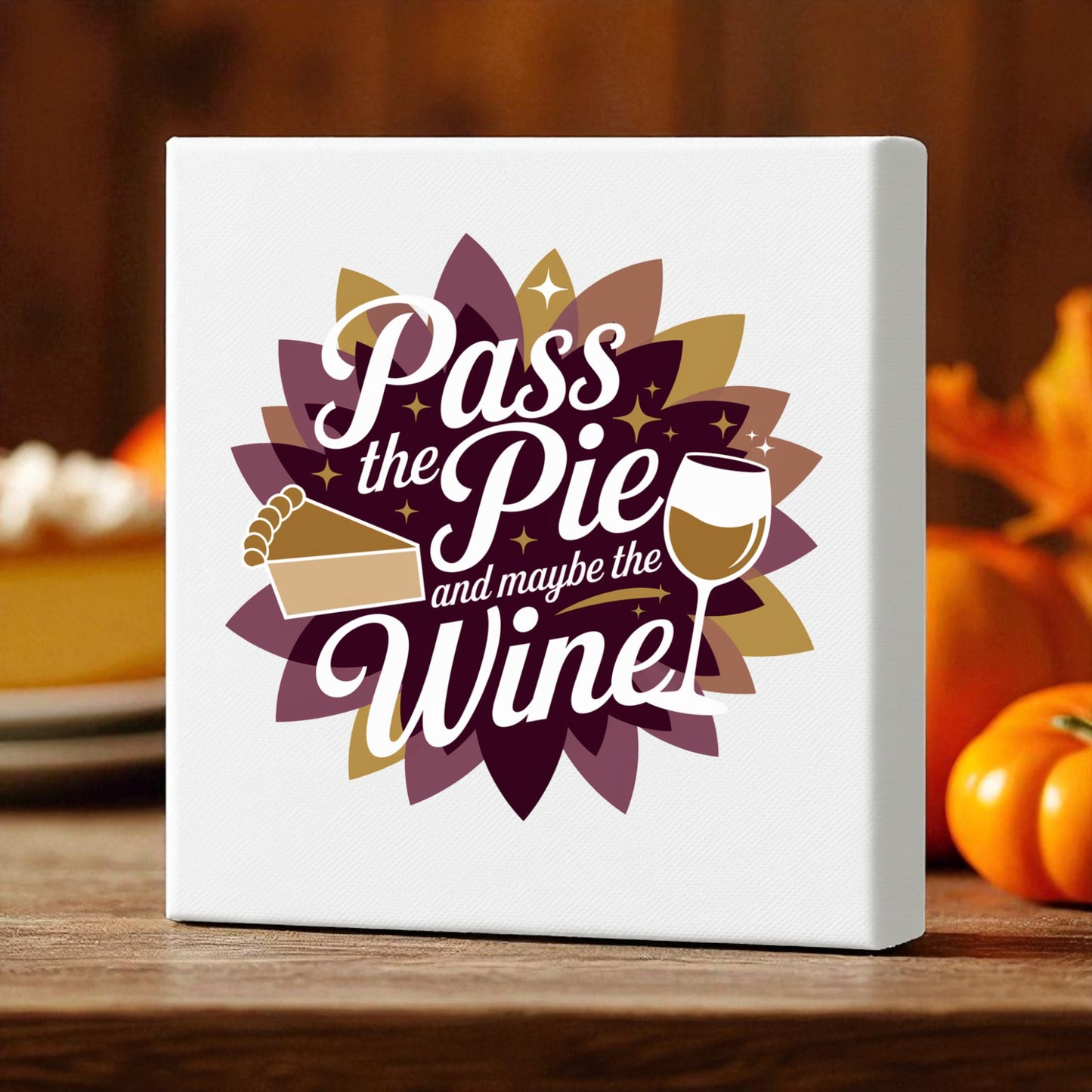 The "Pass the Pie and Maybe the Wine Canvas Sign" by Mirabilia Boutique features a pie slice and wine glass on a floral background—funny Thanksgiving decor perfect for your autumn table with pumpkins and cozy accents.