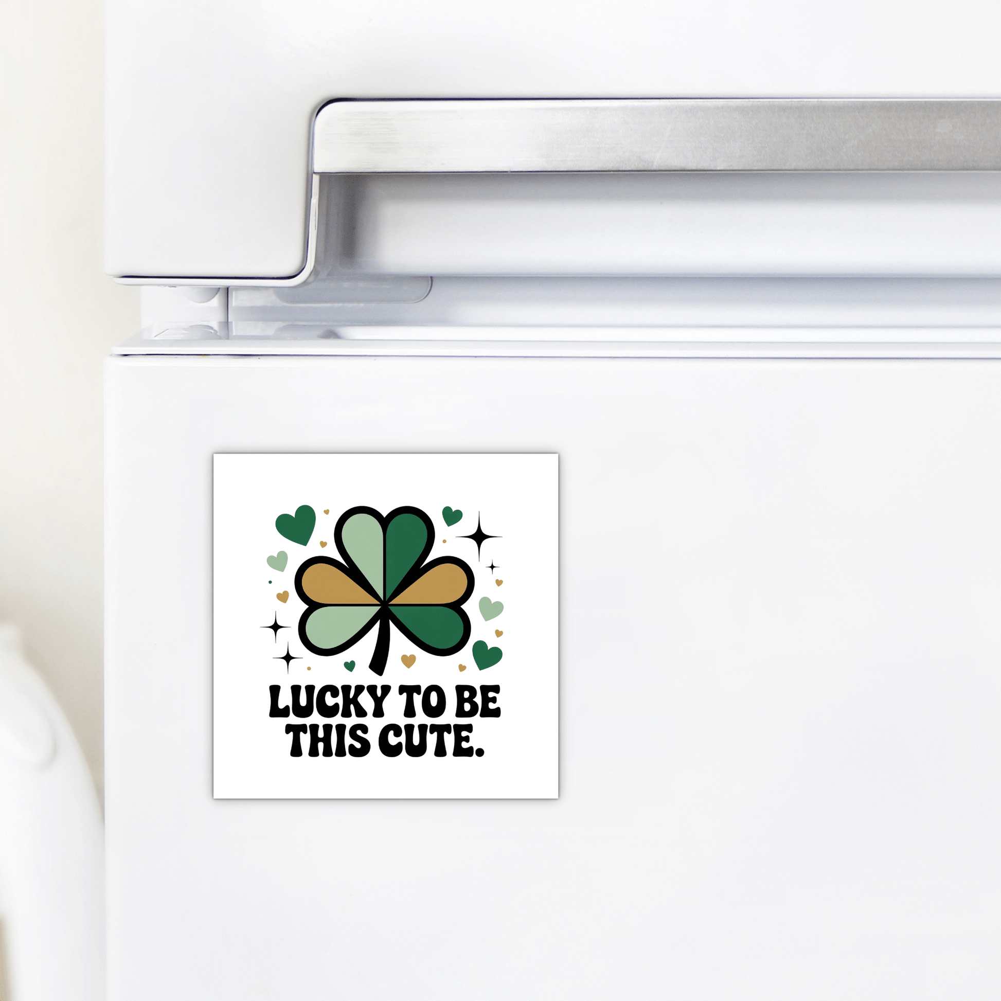 The Lucky to Be This Cute Magnet by Mirabilia Boutique is a square fridge magnet with a green and gold shamrock, hearts, and "Lucky to be this cute" text—an ideal St. Patrick's Day clover gift for any celebration.