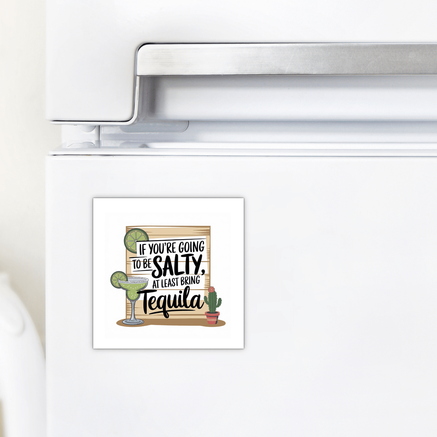 The Salty Tequila Magnet by Mirabilia Boutique features a funny margarita quote and cute cactus art—perfect for adding fun kitchen decor to your white fridge.