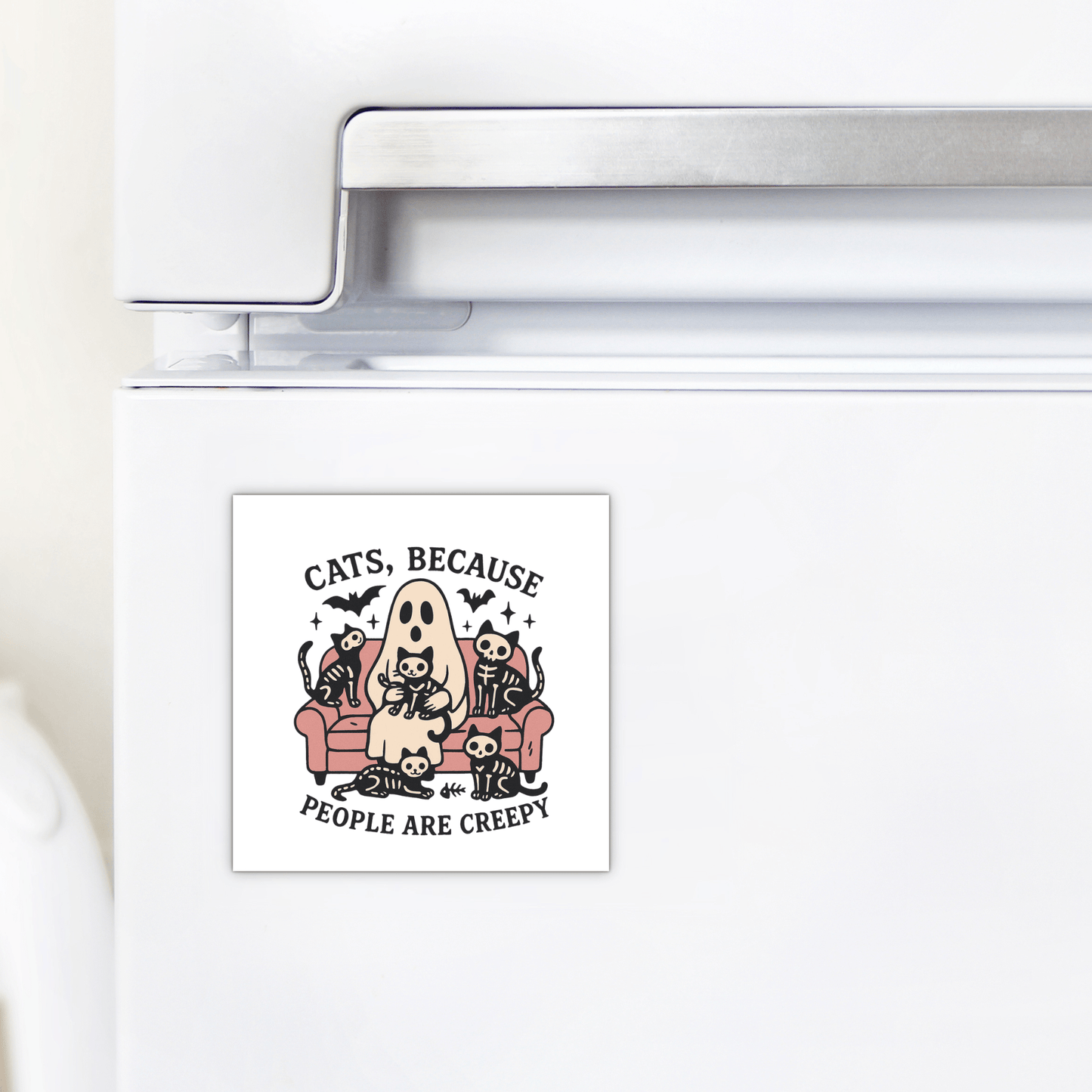 Decorate your fridge with the Mirabilia Boutique Funny Ghost Cat Magnet, featuring a cute ghost on a couch with four cats, bats, and skulls. The magnet reads: "Cats because people are creepy.