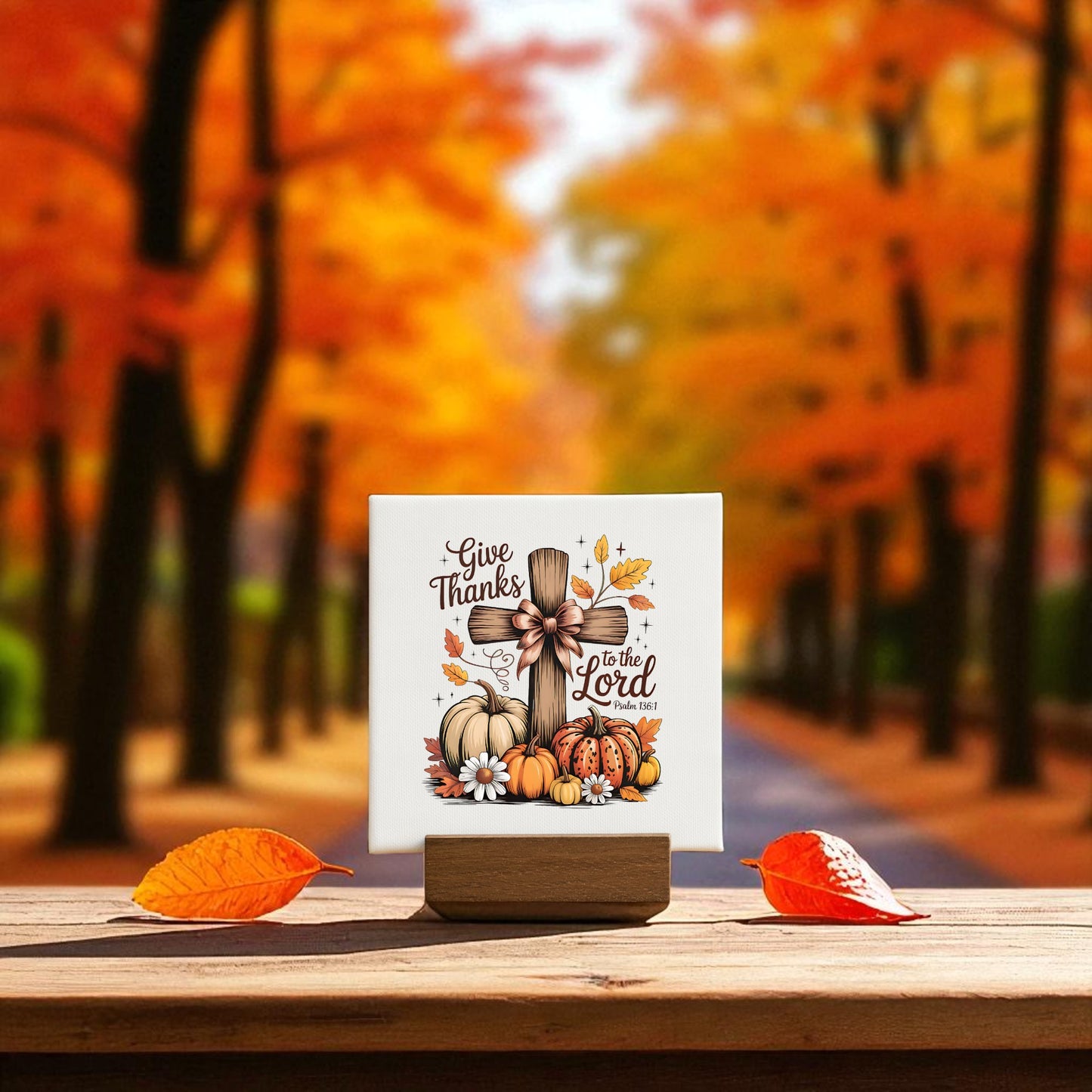 A Mini Thanksgiving Sign from Mirabilia Boutique—a "Give Thanks Cross" with pumpkins, leaves, and flowers—adds Christian fall decor to any space and makes a perfect Thanksgiving gift.