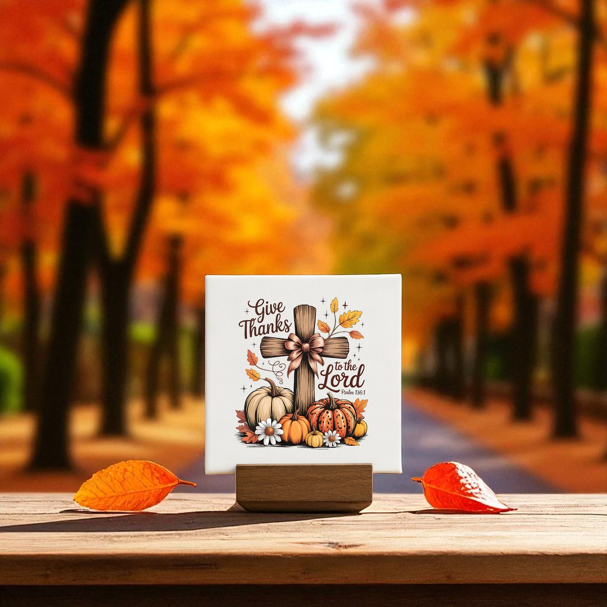 A Mini Thanksgiving Sign from Mirabilia Boutique—a "Give Thanks Cross" with pumpkins, leaves, and flowers—adds Christian fall decor to any space and makes a perfect Thanksgiving gift.