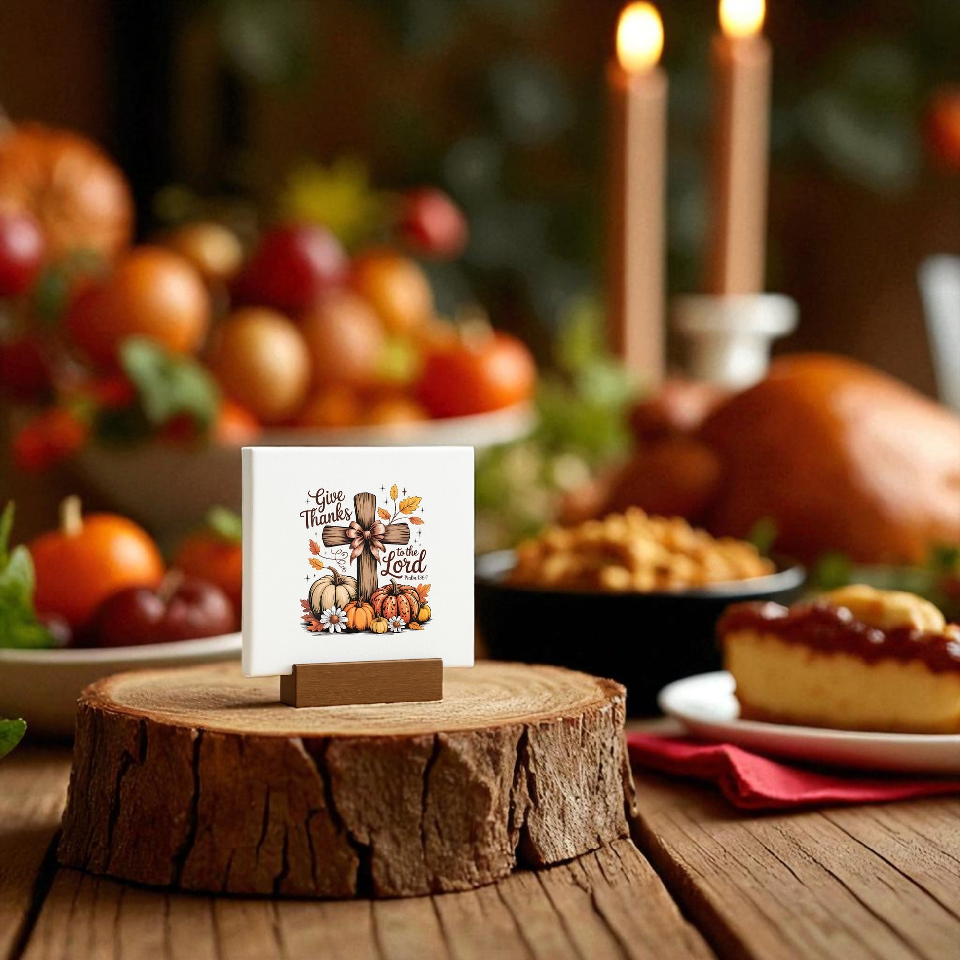 The Mini Thanksgiving Sign | Give Thanks Cross by Mirabilia Boutique features Christian fall decor on a tree stump stand, making it the perfect Thanksgiving gift for your holiday table. Festive food, fruit, and candles create a warm seasonal backdrop.