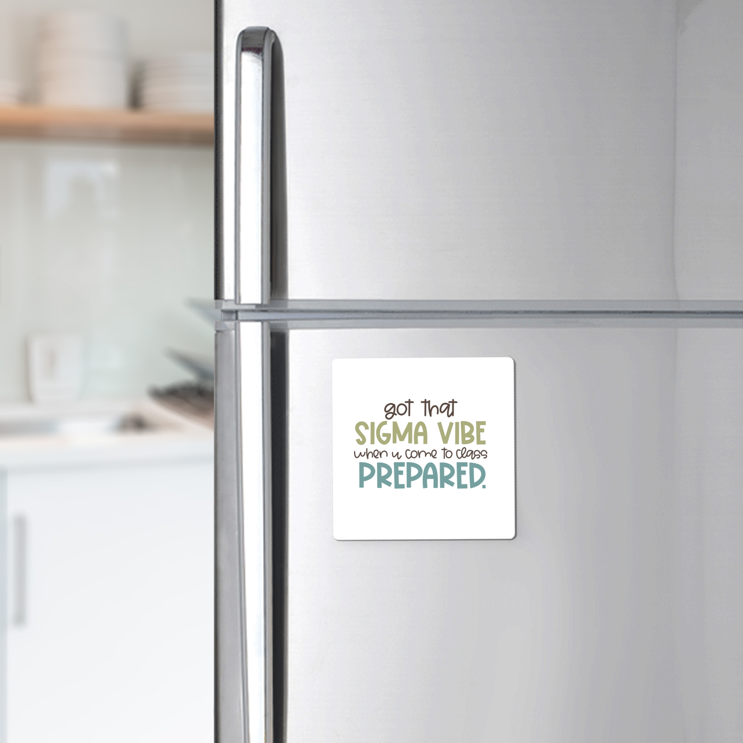 The Mirabilia Boutique Got That Sigma Vibe Classroom Magnet, shown on a stainless steel fridge with a modern kitchen background, reads "got that SIGMA VIBE when it comes to being PREPARED." Great for motivation or teacher appreciation.