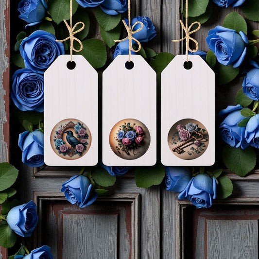 The Wordless Dead Regency Tags by Mirabilia Boutique are a set of three gothic floral wooden tags on strings, shown against a rustic door with blue roses and leaves—ideal for Victorian-inspired decor.