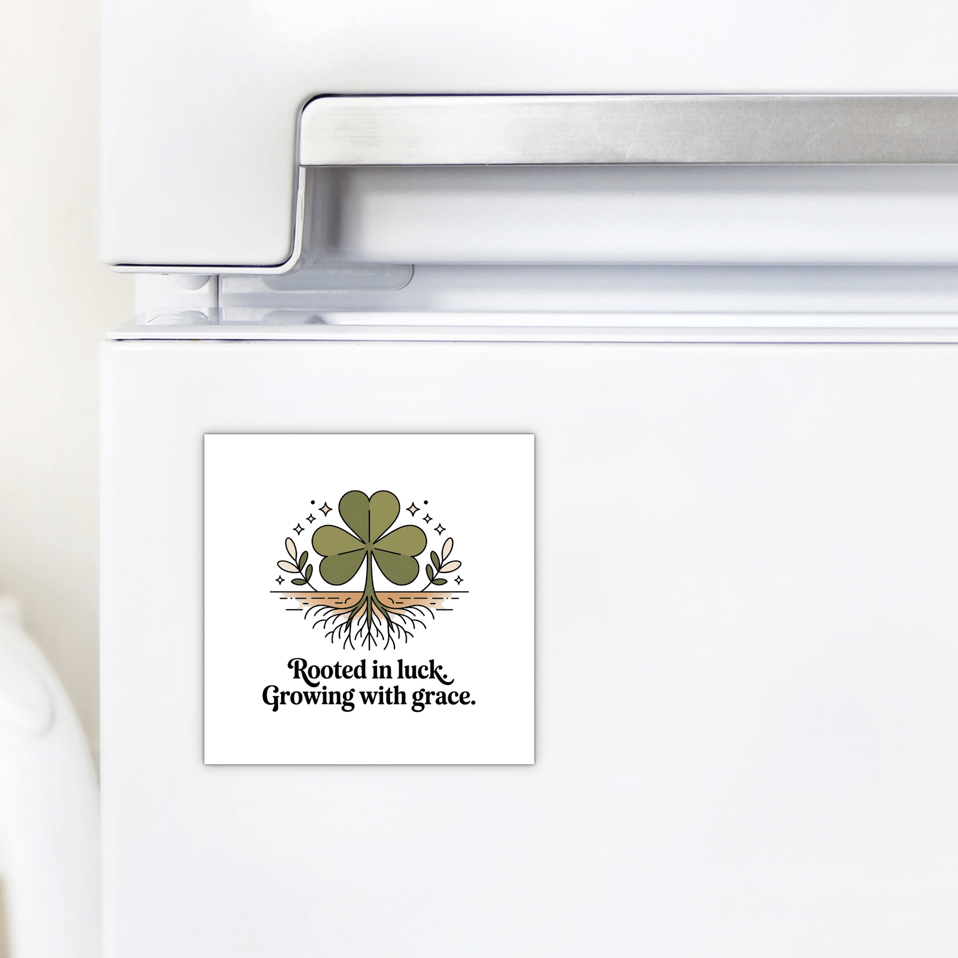 The Mirabilia Boutique Rooted in Luck Shamrock Magnet is a square, Irish-inspired fridge magnet with a green four-leaf clover, roots, stars, and the phrase: "Rooted in luck. Growing with grace.