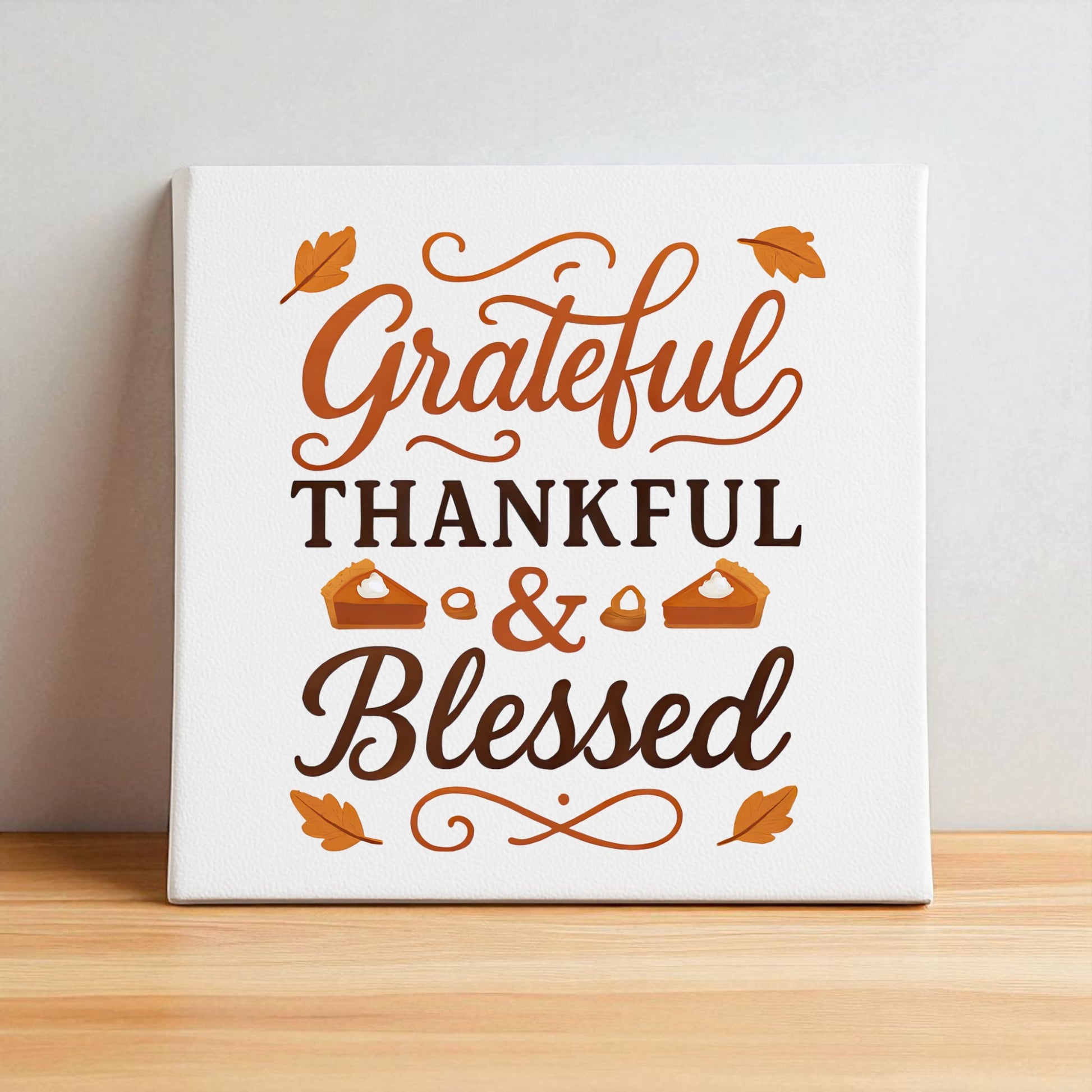 The Grateful Thankful Blessed Canvas by Mirabilia Boutique is an 8x8 fall wall art piece featuring brown and orange script with pie slice and leaf accents—perfect for Thanksgiving or autumn decor.