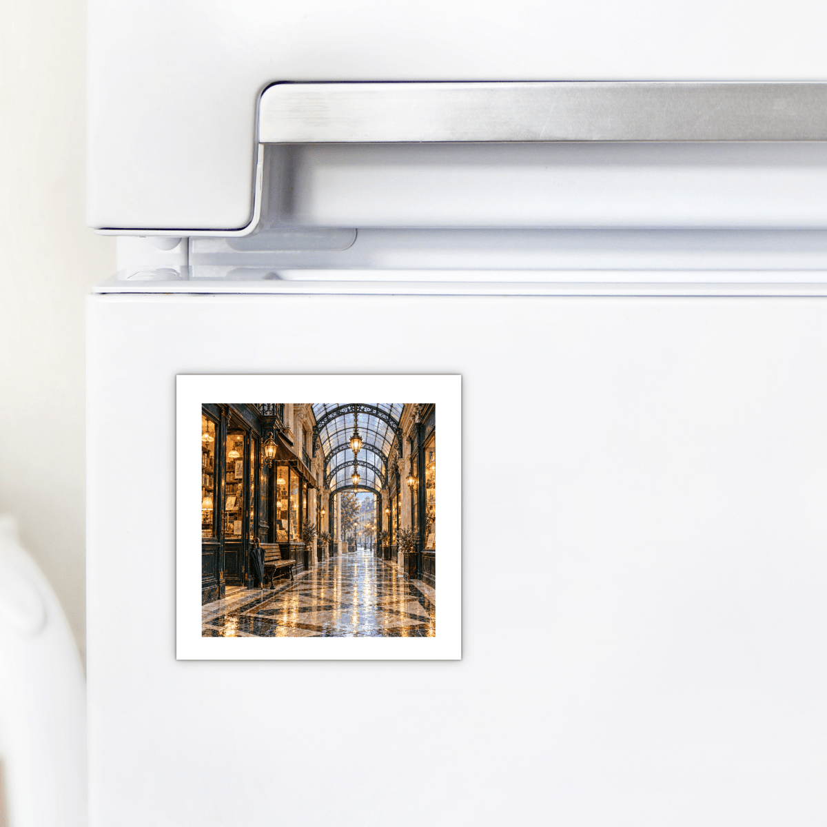 Passage in the Rain Magnet | Paris Toujours square decorative hardboard magnet on a white refrigerator depicting a rainy, illuminated glass-roofed Paris passage.