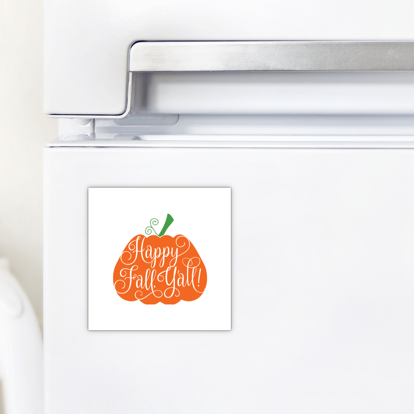 A white fridge adorned with the Mirabilia Boutique Happy Fall Y’all Magnet—a pumpkin-shaped fall decor piece featuring handlettered script—adds festive autumn charm.