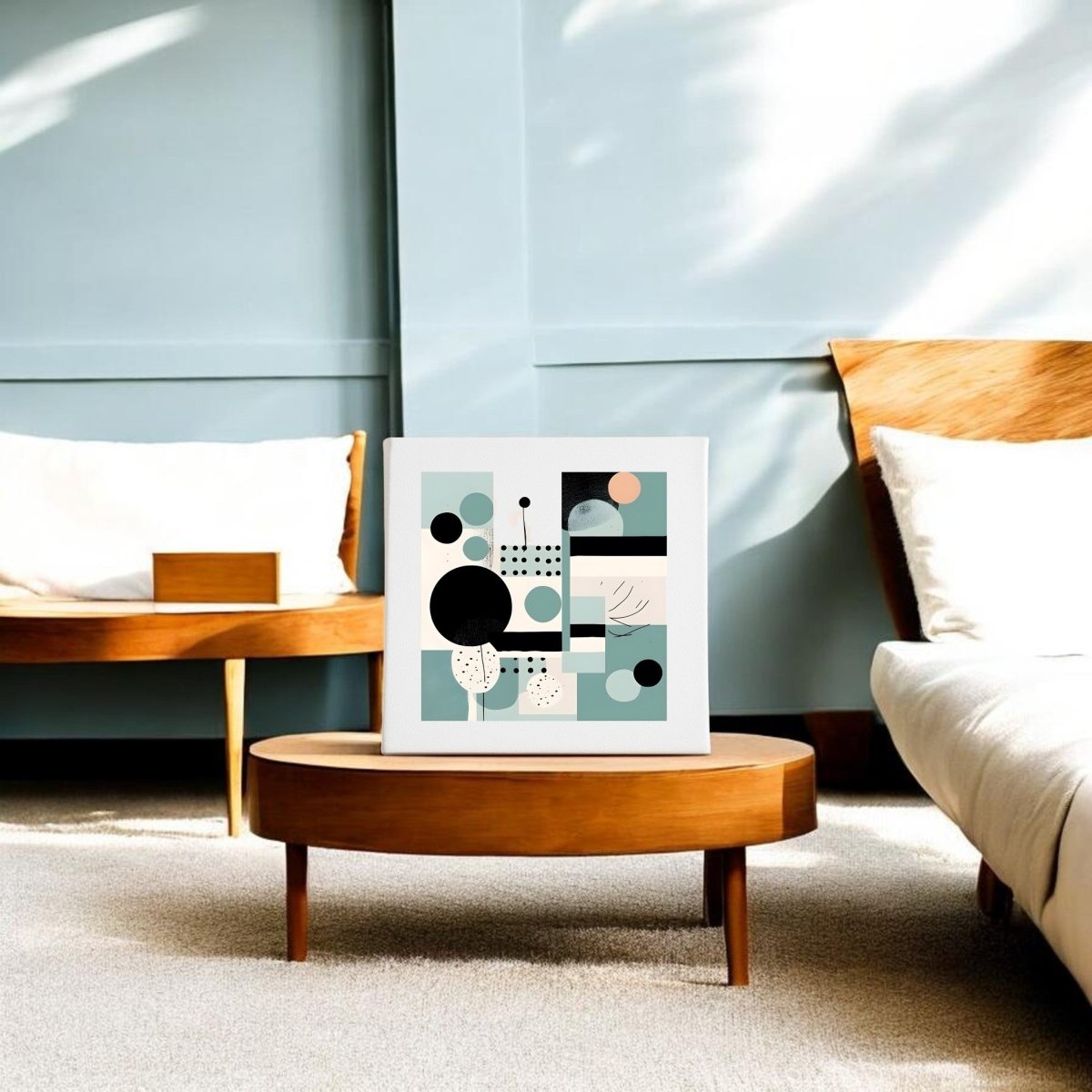 A modern living room with light blue walls, wooden furniture, and a white sofa. A low wooden table displays the Harbor Morning Mid Century Modern Canvas by Mirabilia Boutique, featuring abstract geometric shapes in black, white, teal, and beige.