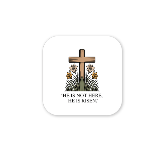 An illustration of a wooden cross stands behind lilies and grass with the text “HE IS NOT HERE, HE IS RISEN!”—the perfect He Is Risen Easter Magnet – Cross & Lily Scripture Art by Mirabilia Boutique for celebrating the resurrection.