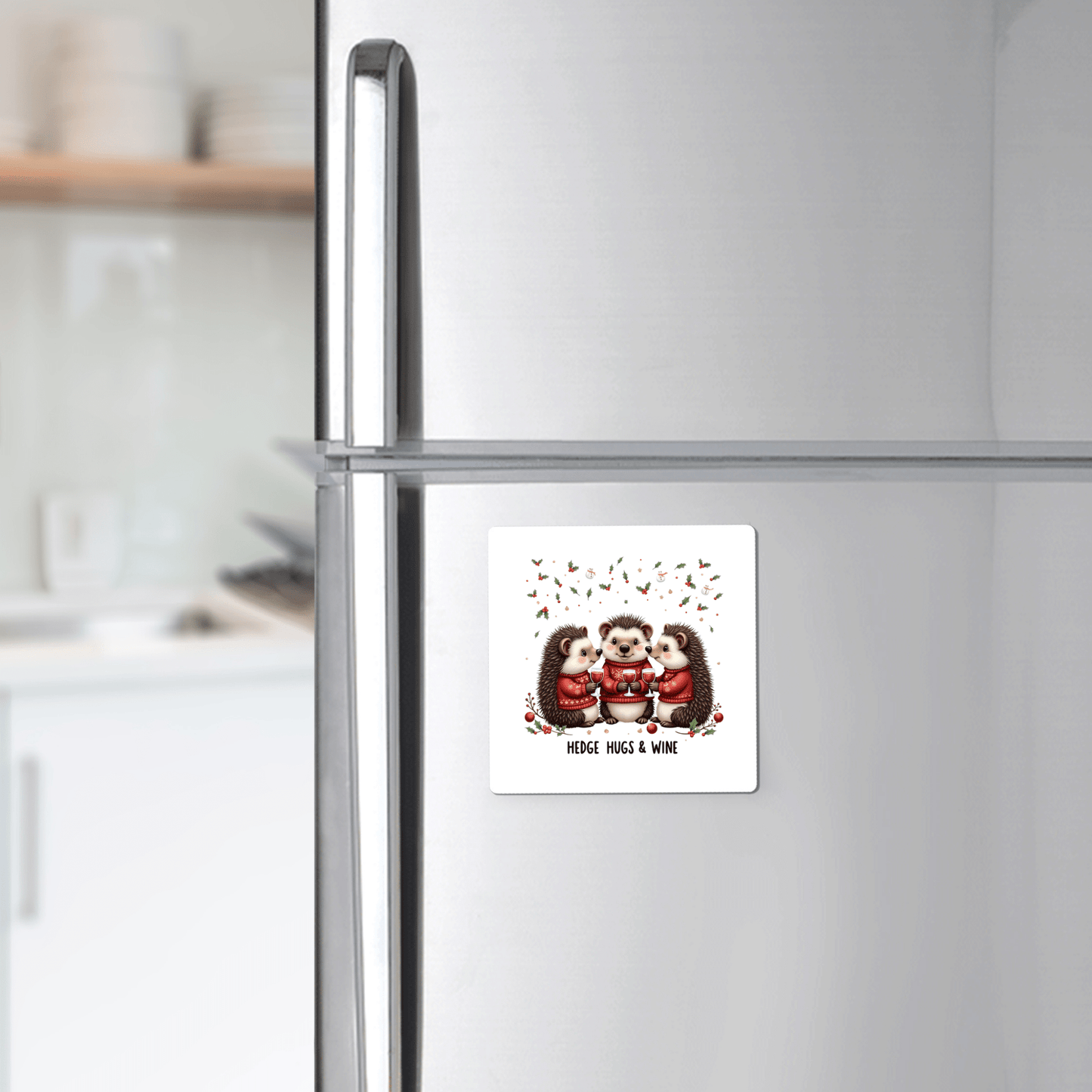 The Hedge Hugs & Wine Magnet by Mirabilia Boutique features three illustrated hedgehogs with mugs and the quote "Hedge Hugs & Wine." This whimsical kitchen magnet makes a funny holiday gift for wine lovers.