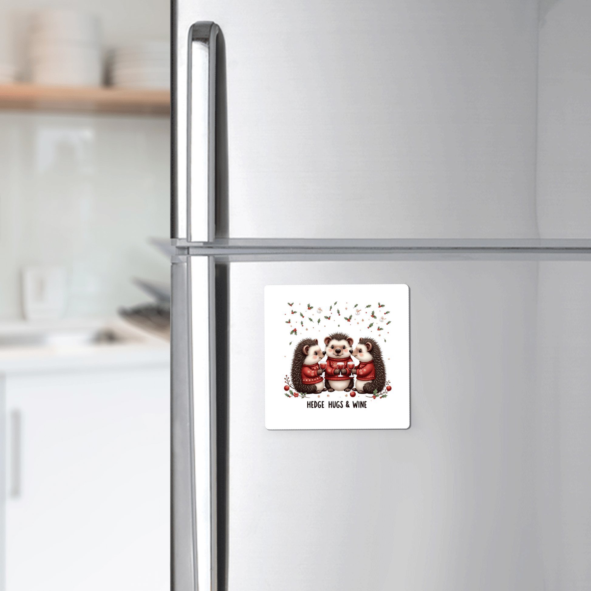 The Hedge Hugs & Wine Magnet by Mirabilia Boutique features three illustrated hedgehogs with mugs and the quote "Hedge Hugs & Wine." This whimsical kitchen magnet makes a funny holiday gift for wine lovers.