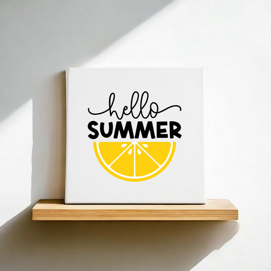 The Mirabilia Boutique Hello Summer Lemon Canvas Sign – 8x8 Wall Art sits on a wooden shelf, with “hello SUMMER” above a yellow lemon slice, and sunlight casting a shadow—an ideal touch for your summer home decor.