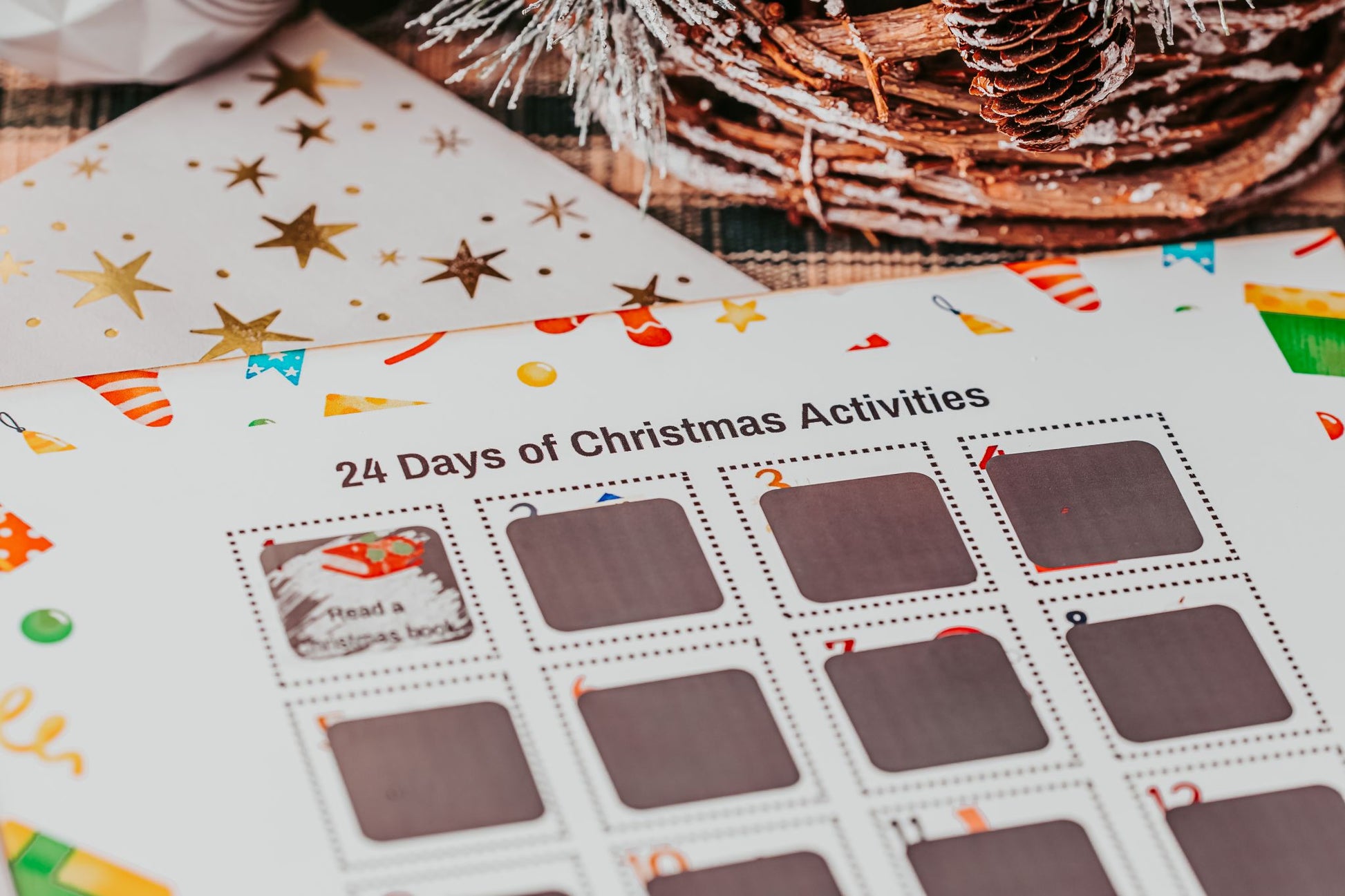 A close-up of the Mirabilia Boutique Scratch-Off Christmas Activity Calendar reveals one of 25 fun festive activities for kids: “Read a Christmas book.” This colorful holiday countdown poster is perfect for memorable family celebrations.