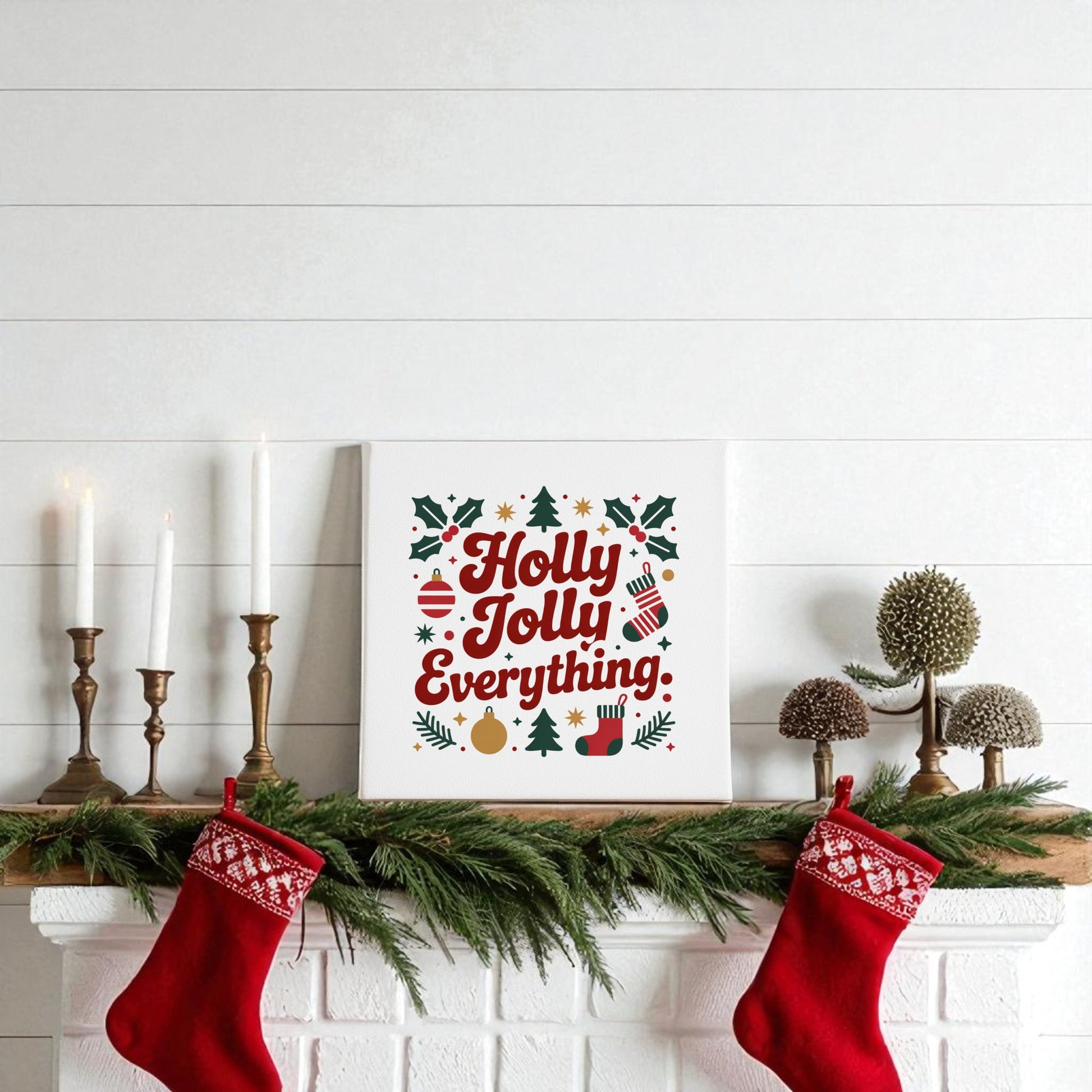 A white mantel adorned with candles and stockings features the "Holly Jolly Everything" 8x8 Christmas Canvas Print by Mirabilia Boutique—perfect holiday wall art to add festive charm to your home decor.