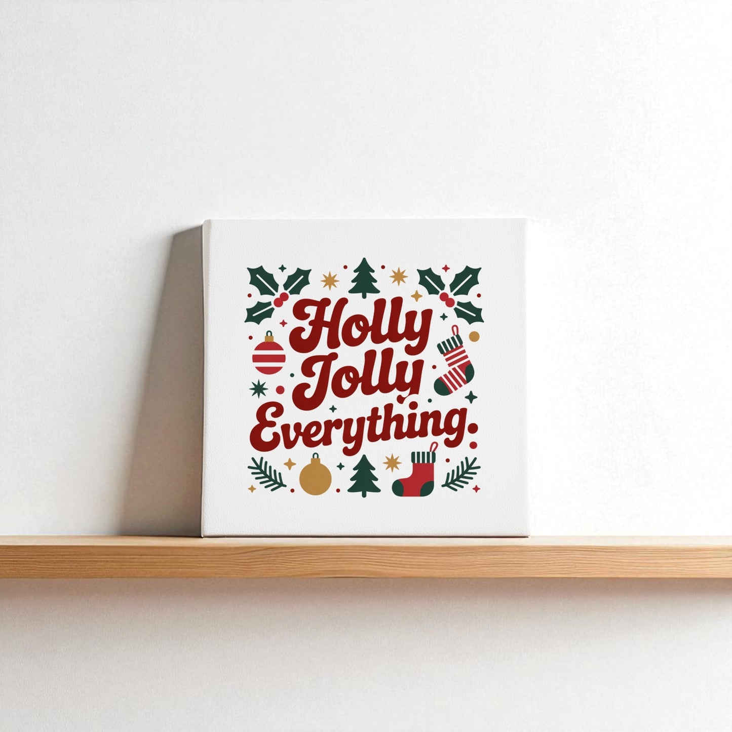 The "Holly Jolly Everything" 8x8 Christmas Canvas Print by Mirabilia Boutique features festive red text and icons, making it perfect holiday wall art and decor for your home.