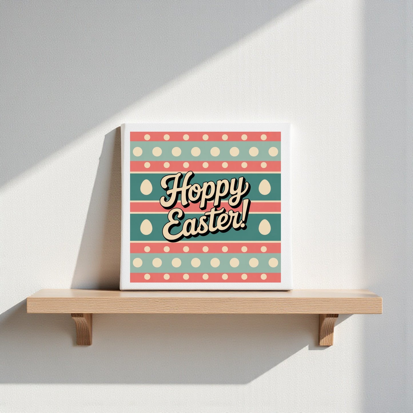 The Hoppy Easter Canvas – Retro 8x8 Spring Wall Art by Mirabilia Boutique features playful “Hoppy Easter!” text with pastel stripes, polka dots, and egg shapes—perfect for brightening your spring décor.