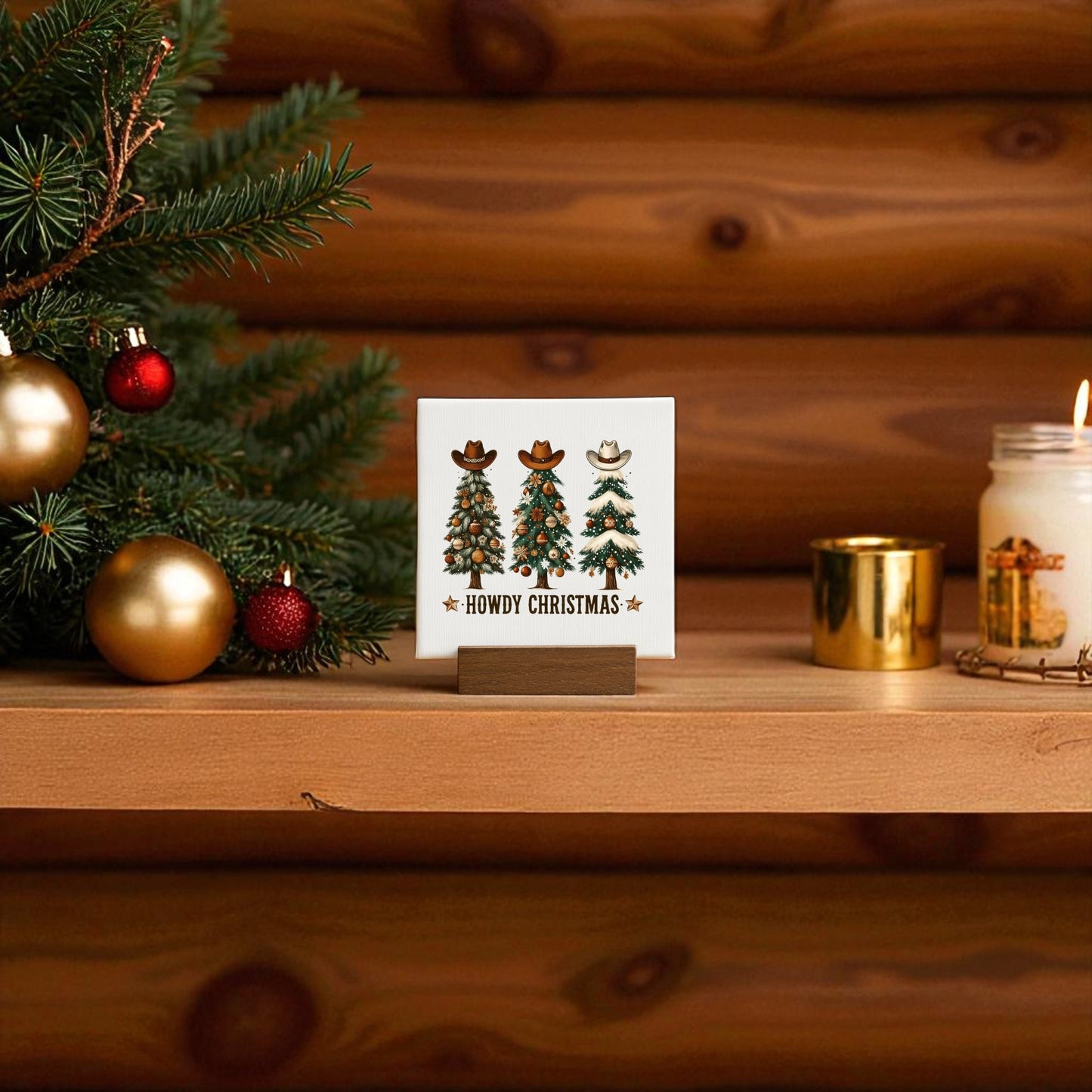 Add a Western touch to your holidays with the Howdy Christmas Mini Sign by Mirabilia Boutique—perfect shelf decor featuring cowboy hats, boots, festive pine branches, ornaments, and rustic charm.