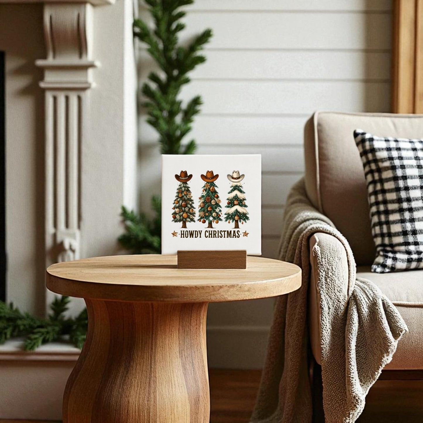 The Howdy Christmas Mini Sign by Mirabilia Boutique, featuring three cowboy hat-wearing trees and festive text, adds Western holiday charm to any cozy living space with rustic decor.