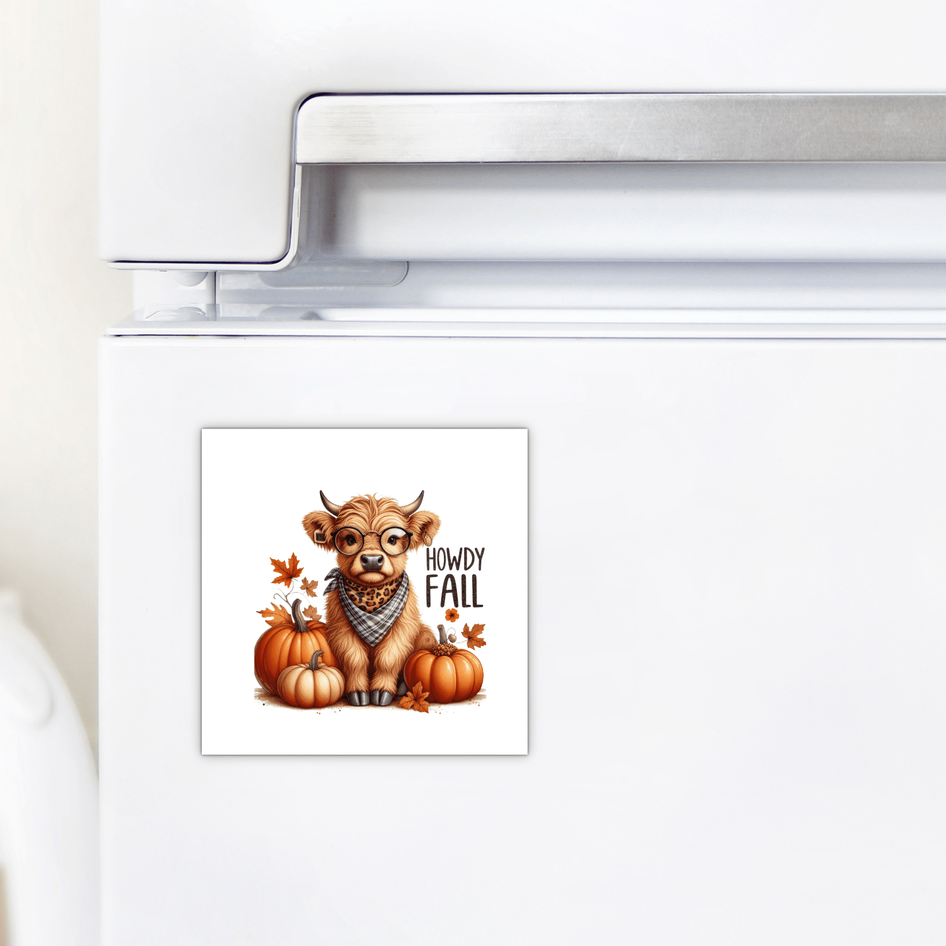 The Howdy Fall Highland Cow Magnet by Mirabilia Boutique features a cute cow in a bandana with pumpkins, leaves, and “Howdy Fall” text—perfect autumn kitchen decor for your farmhouse fridge.