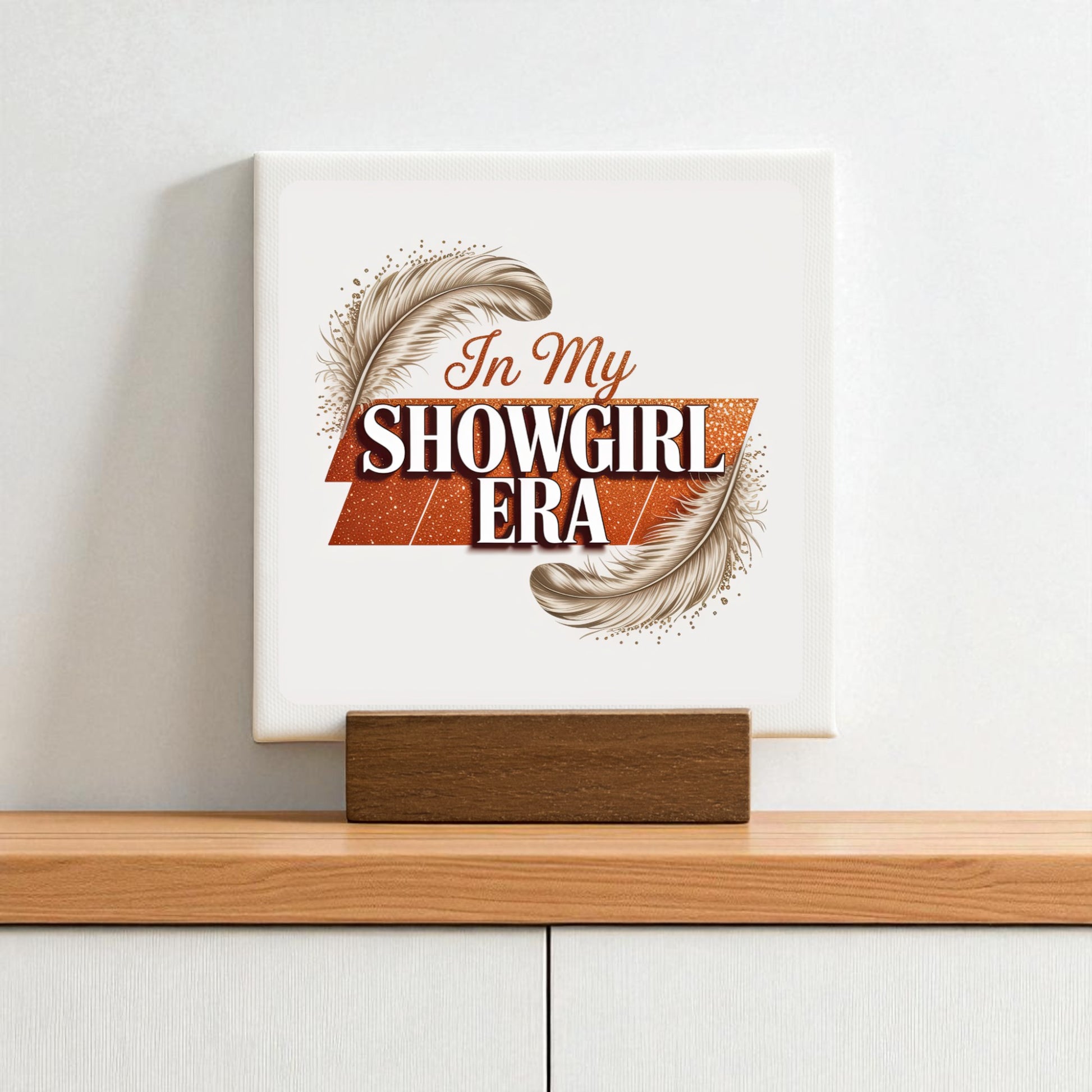 The Mirabilia Boutique "In My Showgirl Era" Mini Sign features bold retro glam lettering and feather accents on a wooden stand—an ideal vintage showgirl decor piece for your shelf or desk.
