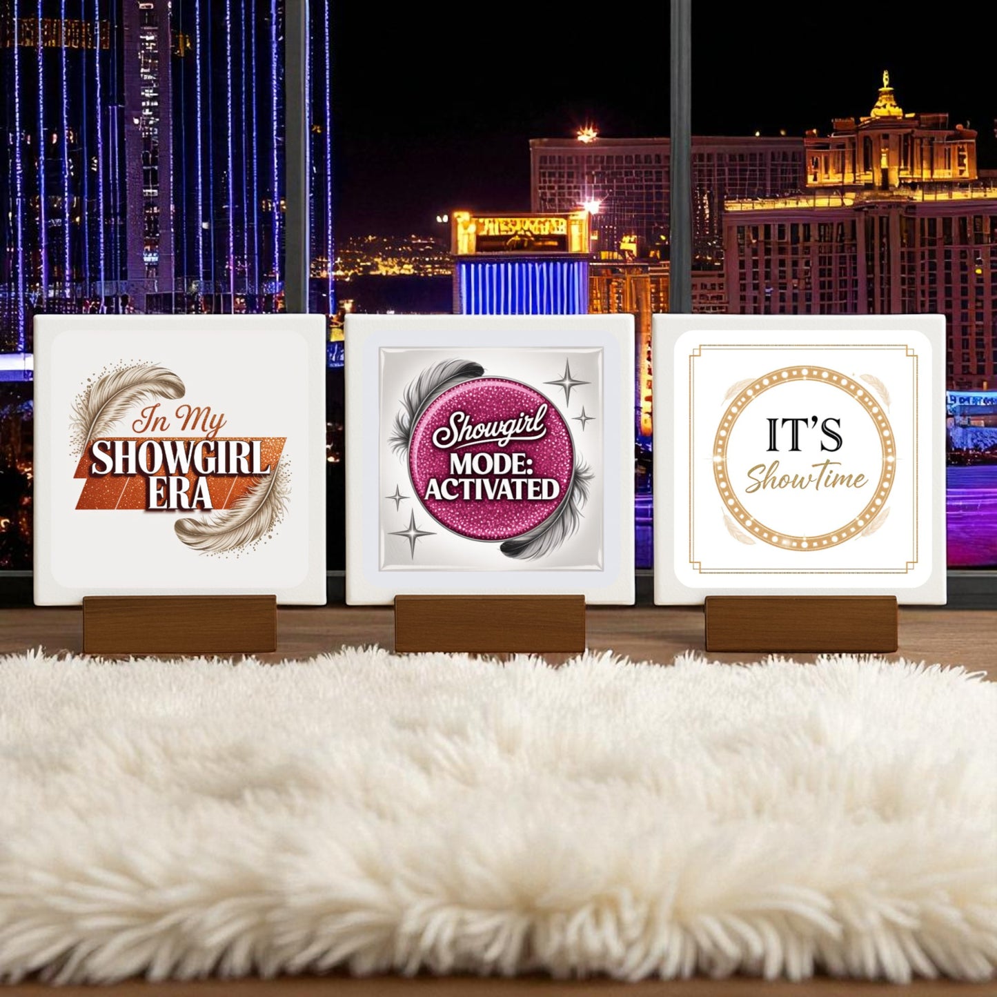 Three "In My Showgirl Era" mini signs from Mirabilia Boutique rest on a shaggy white rug in front of a night city window. These retro glam decor pieces add the perfect touch of vintage showgirl style to any space.