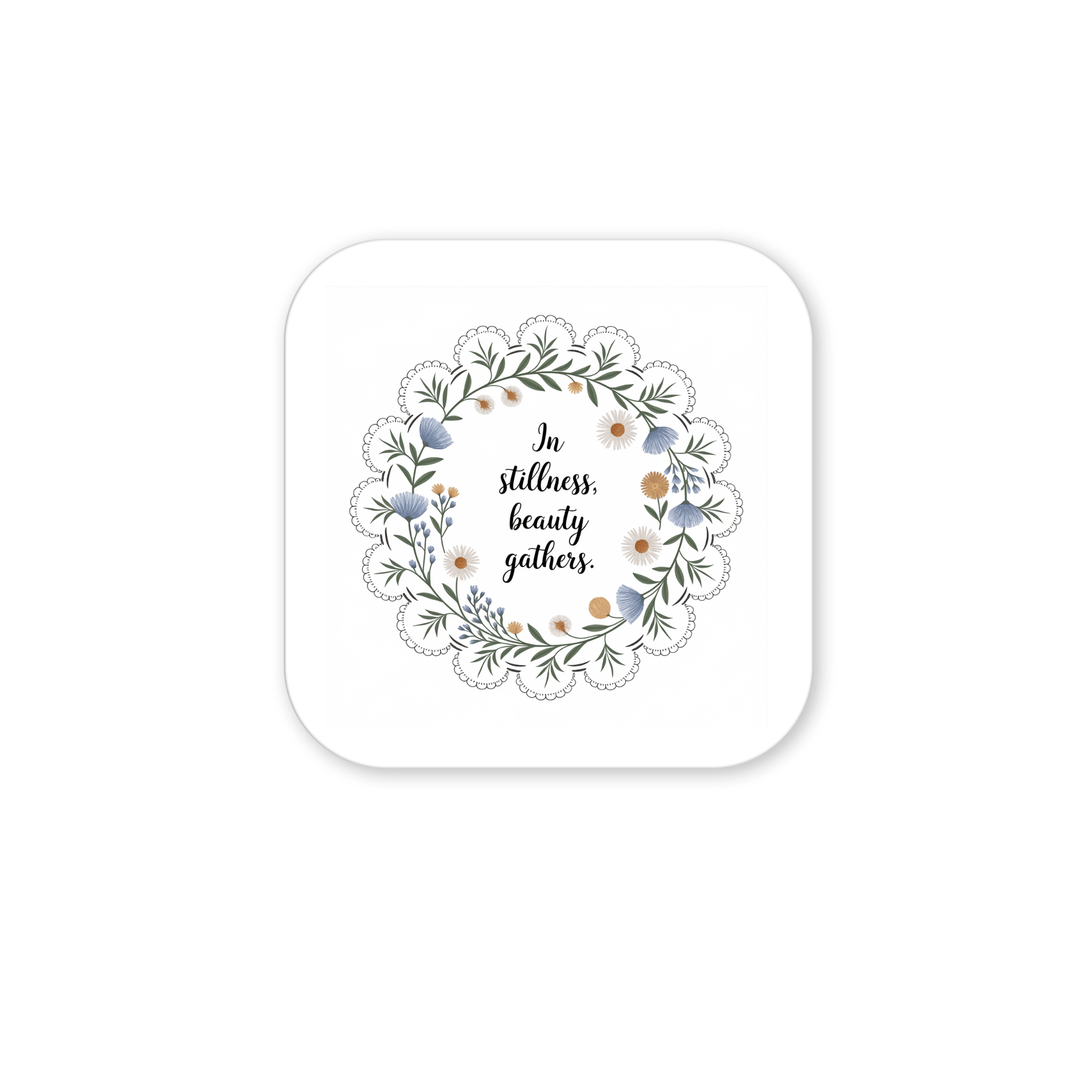 The Mirabilia Boutique In Stillness Beauty Gathers Floral Quote Magnet features a square design with a wreath of green leaves and flowers around the handwritten quote—an inspiring mindfulness accent for any space.