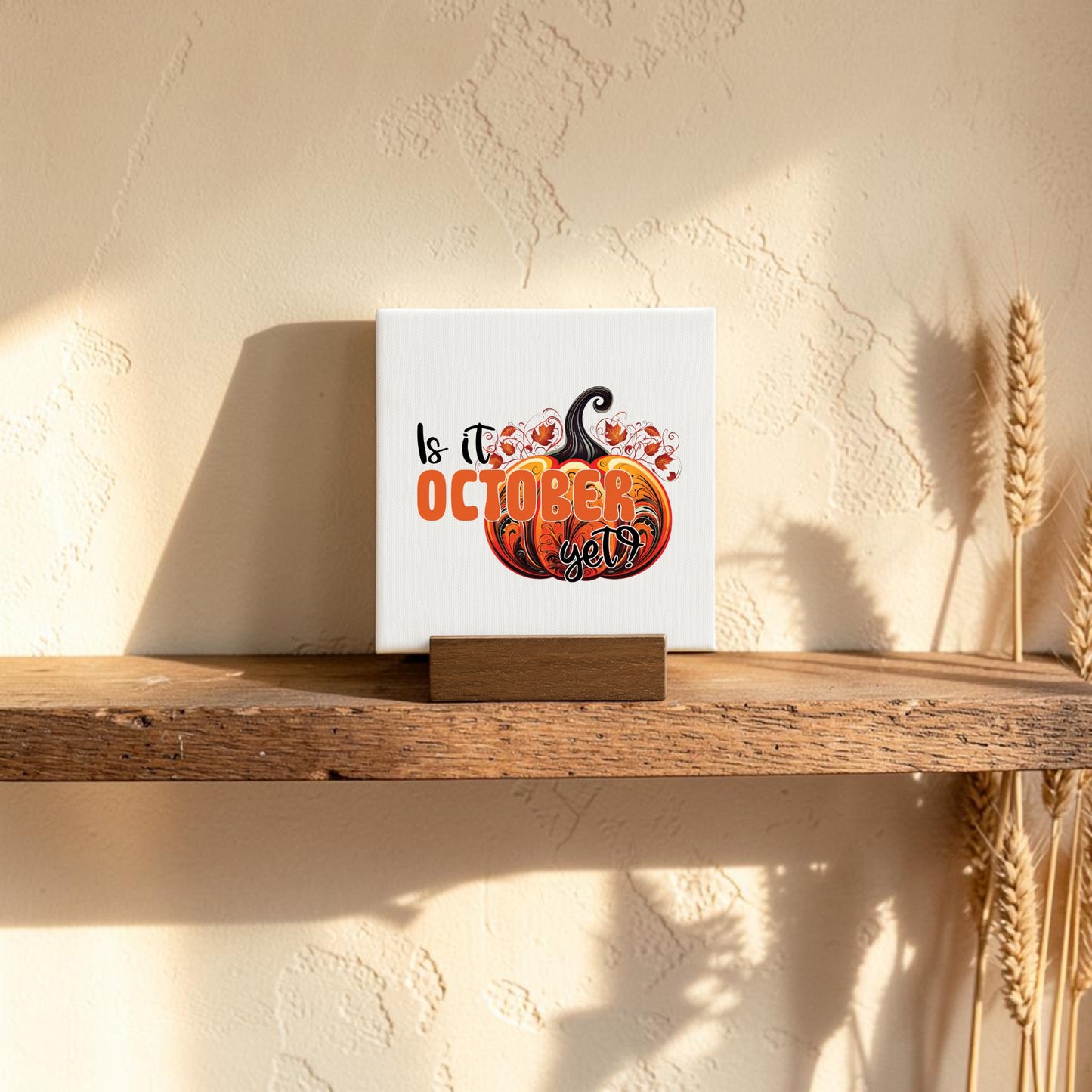 The "Is It October Yet? Mini Sign" by Mirabilia Boutique features a pumpkin and autumn leaves design, making it perfect fall decor for your shelf or mantel. The mini sign adds a cozy seasonal touch to any space.