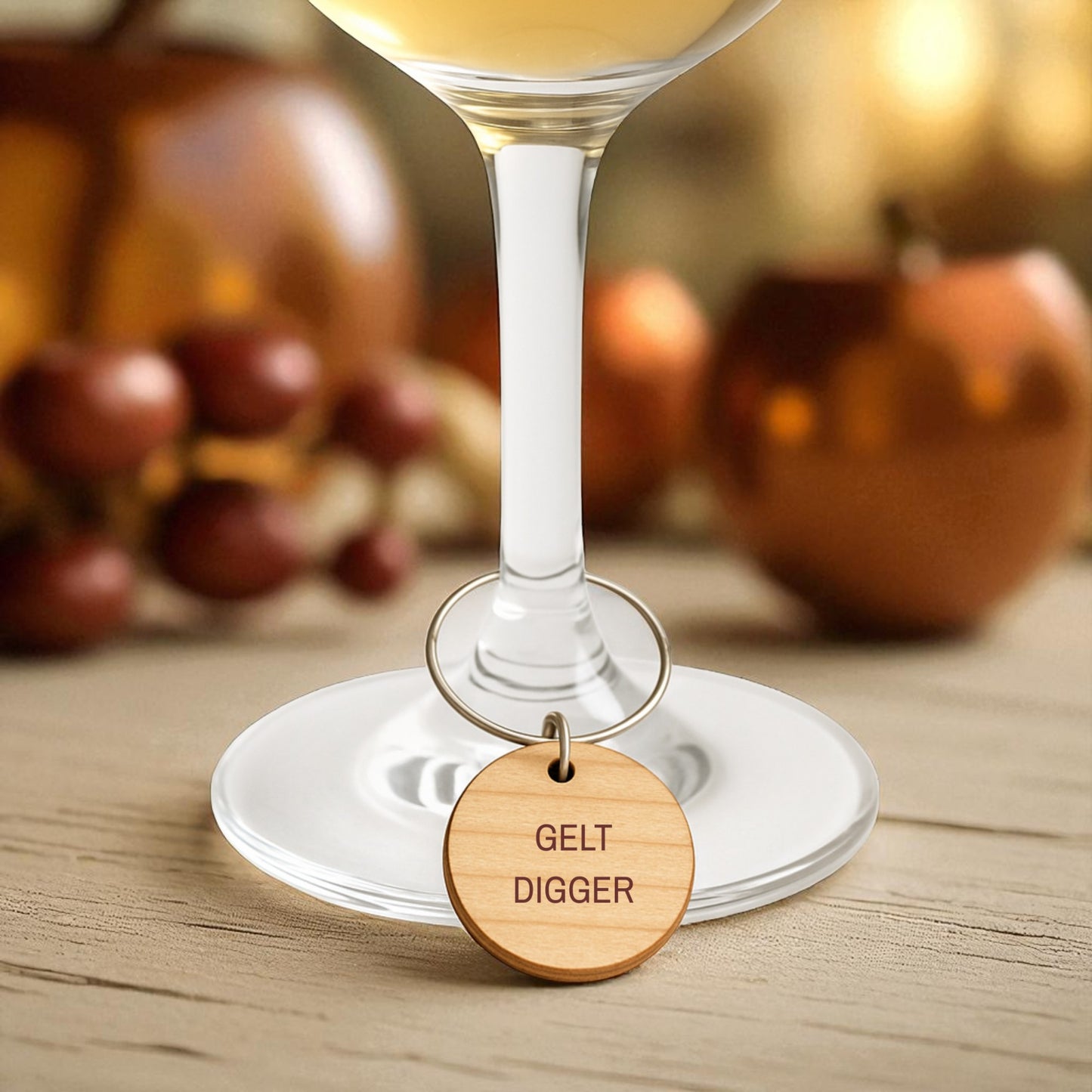 Mirabilia Boutique’s Jewish Wine Charms—Hanukkah Wine Glass Markers Set of 8—feature playful engraved wooden charms like "GELT DIGGER." Perfect for unique Jewish holiday gifts, these add festive flair to any wine glass.