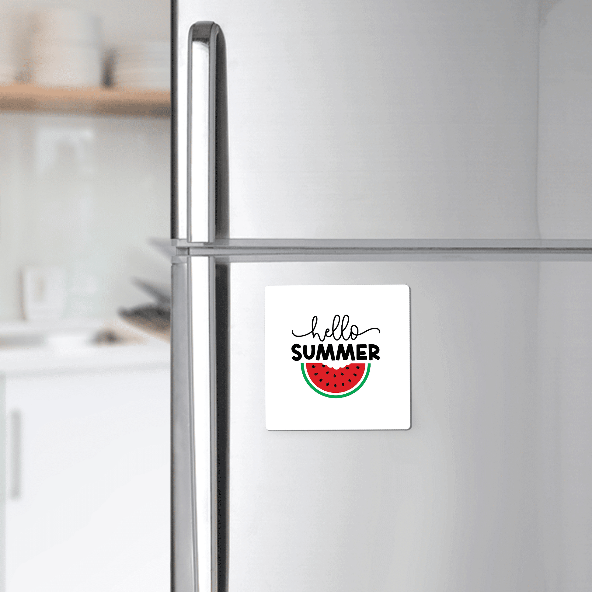 The Hello Summer Watermelon Magnet by Mirabilia Boutique adds juicy seasonal style to any silver fridge—a vibrant accent for modern kitchens.