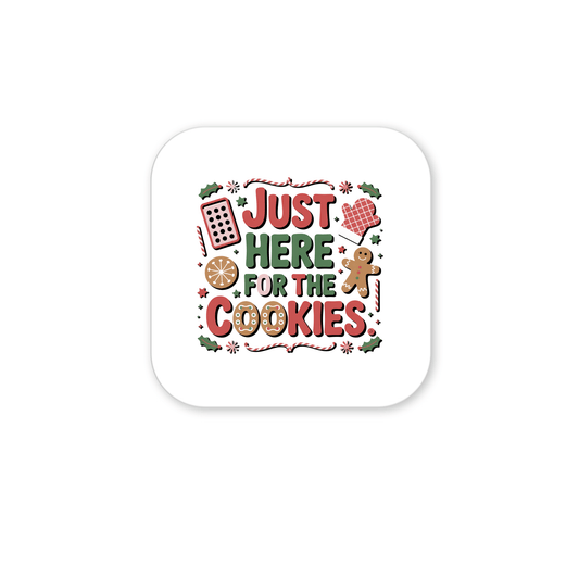 The "Just Here for the Cookies" Magnet by Mirabilia Boutique features festive red, green, and brown baking designs—making it a funny Christmas fridge decor and a perfect gift for cookie lovers.