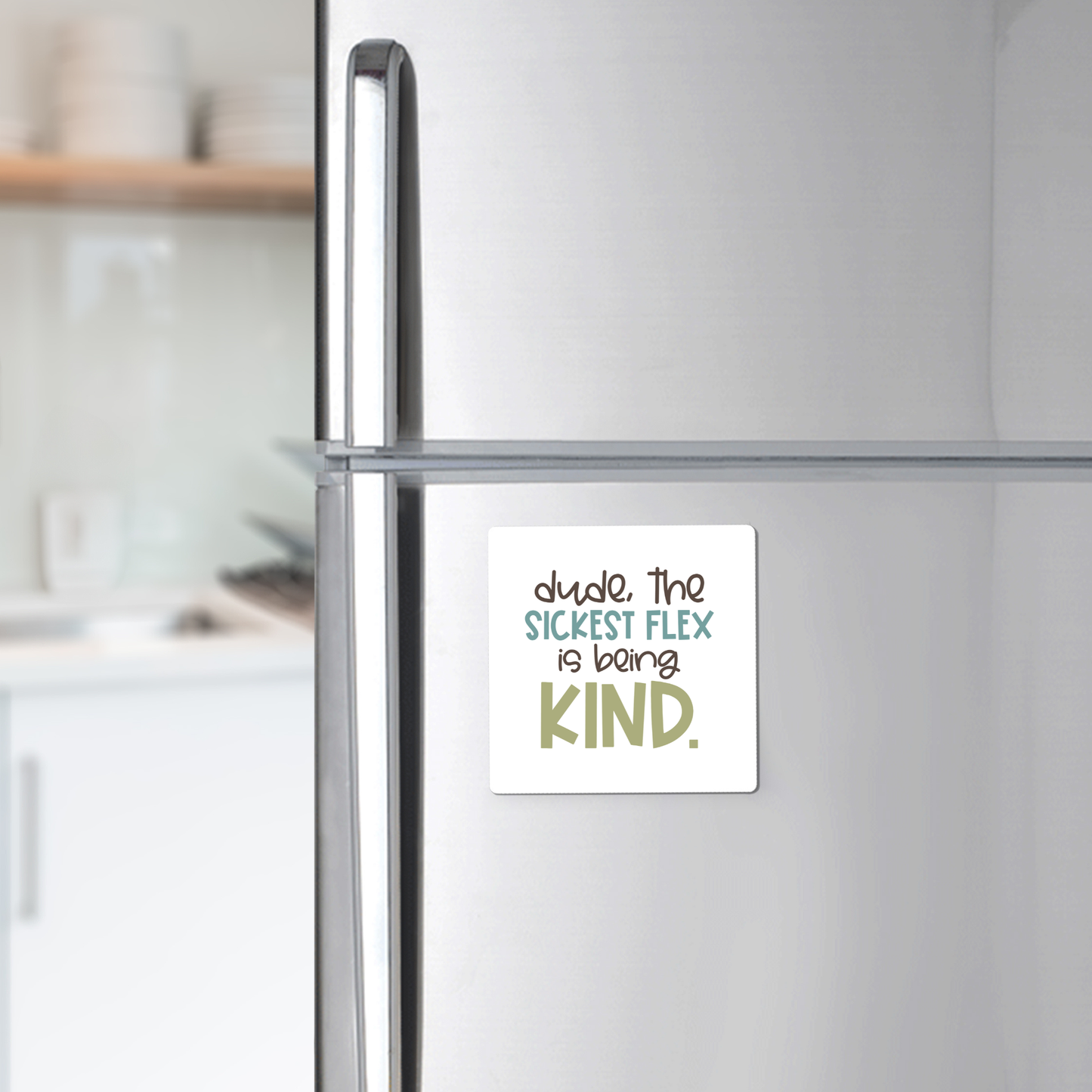 The Sickest Flex Is Being Kind Magnet by Mirabilia Boutique, featuring the phrase "dude. the SICKEST FLEX is being KIND," adds inspiration to any bright kitchen—perfect for teachers or uplifting classroom décor.
