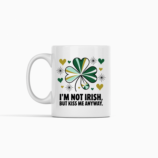 The Kiss Me Anyway Mug – St. Patrick’s Day Charm by Mirabilia Boutique features a green, gold, and black shamrock design with hearts, sparkles, and “I’m not Irish, but kiss me anyway”—perfect for celebrating your lucky side!.