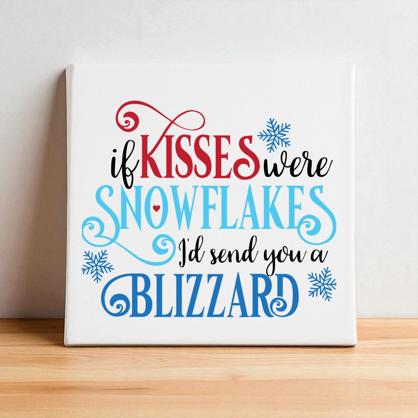 Mirabilia Boutique’s “If Kisses Were Snowflakes | Winter Quote Wall Art | Blizzard Sign” features playful red, blue, and black lettering with blue snowflakes—a charming romantic accent for your winter decor.