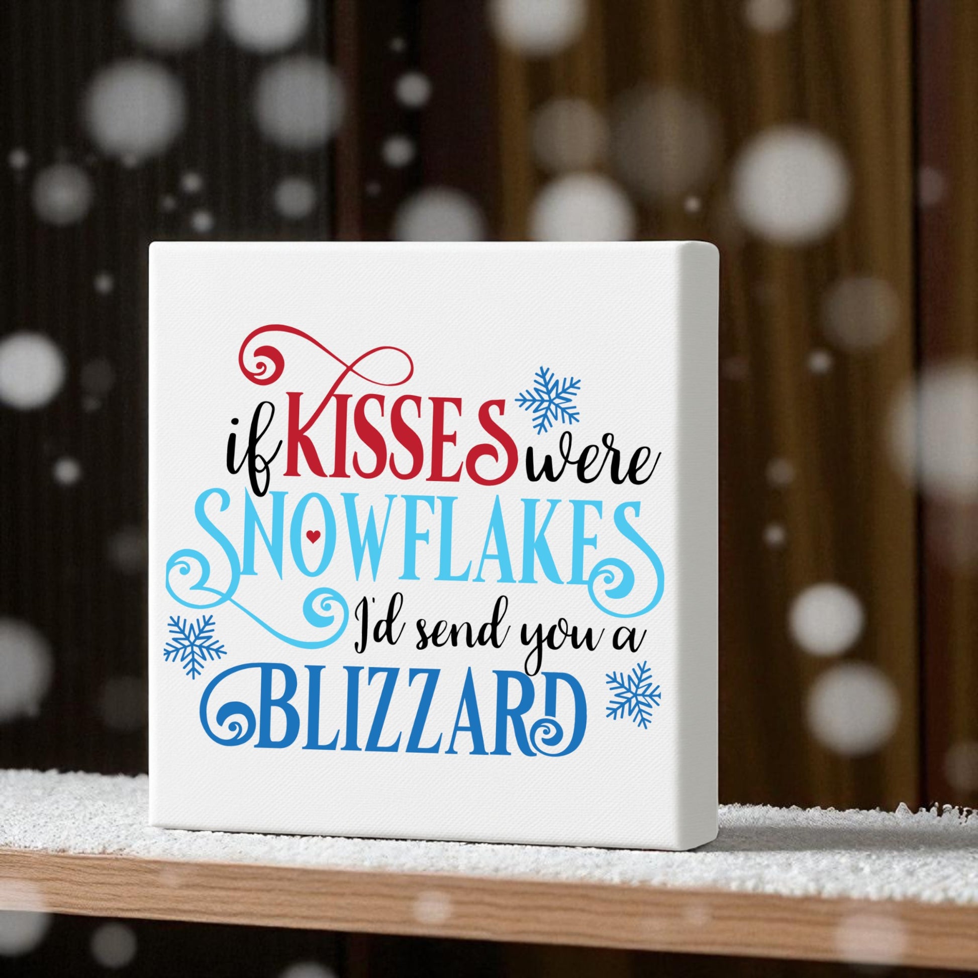 Mirabilia Boutique’s “If Kisses Were Snowflakes | Winter Quote Wall Art | Blizzard Sign” is perfect romantic decor. The playful sign sits on snowy ground, reading: "If kisses were snowflakes, I'd send you a blizzard.