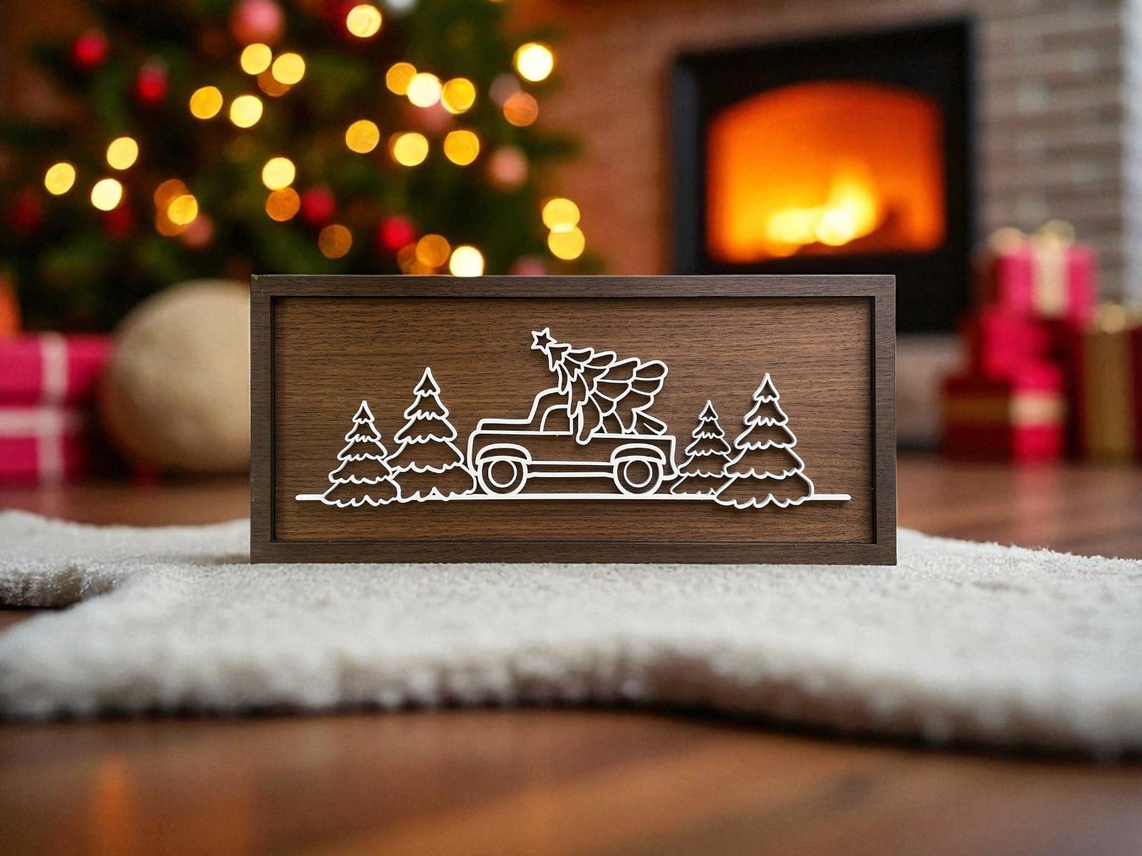 The Mirabilia Boutique Truck & Tree Laser Cut Christmas Sign (9x4) features a white-outlined truck with a tree, perfect rustic wall art for modern farmhouse holiday decor.