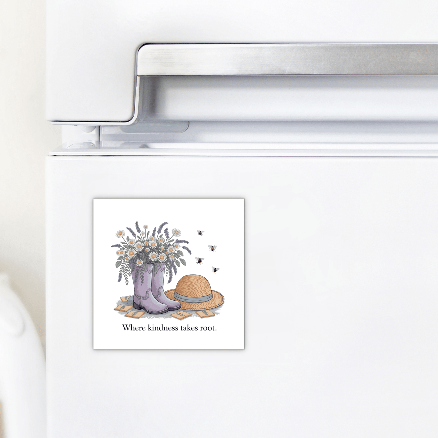 The Kindness Garden Magnet – Floral Boots & Bees Quote by Mirabilia Boutique features purple boots with flowers, bees, a straw hat, and the phrase "Where kindness takes root"—a thoughtful kindness gift for any fridge.